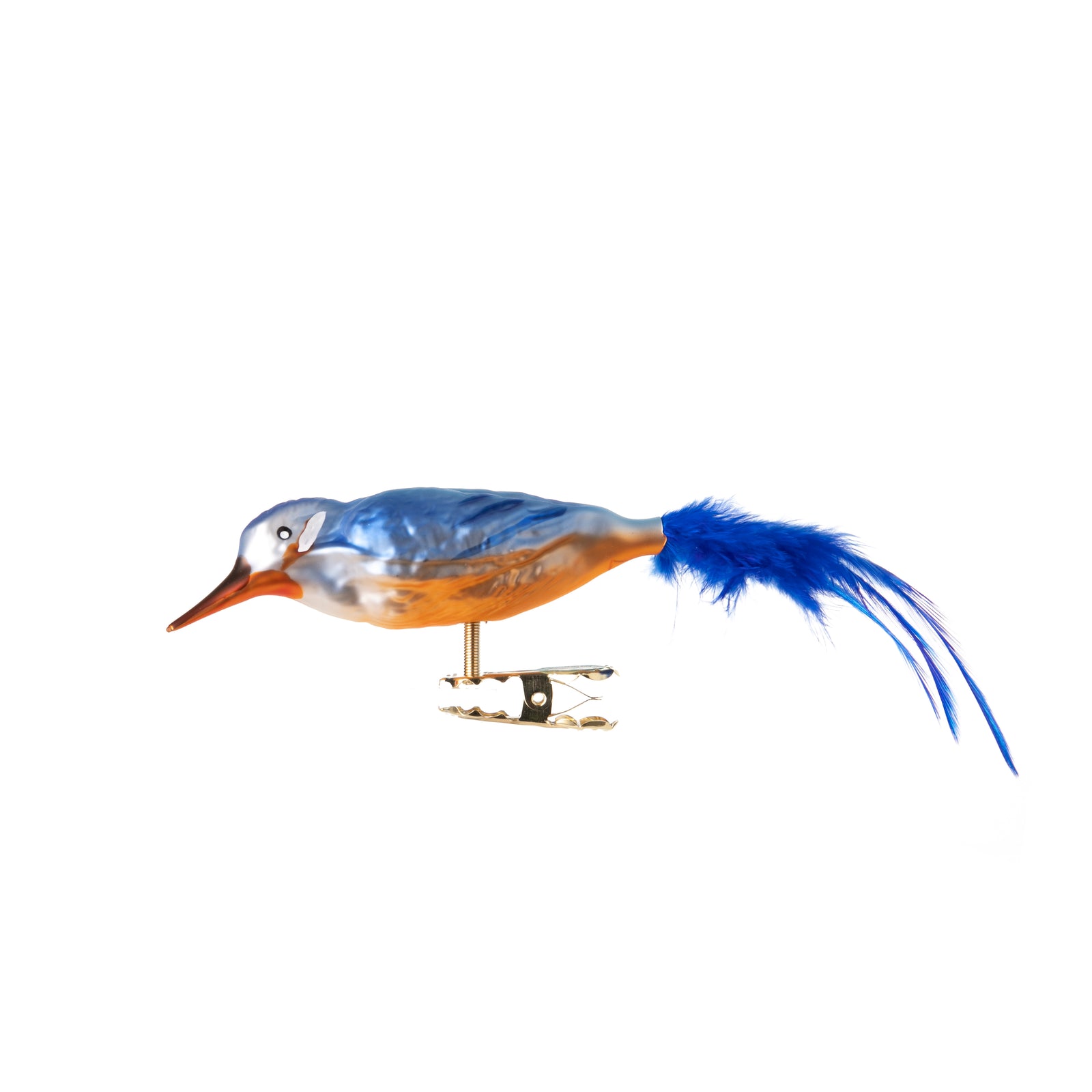 This colorful Kingfisher is made from hand-blown glass in a traditional family-owned studio in Limbach, Germany.  Its tail is delicately trimmed with real feathers, and it has a hand-painted finish. Attaches with a strong clip Traditionally made in Germany Dimensions approx: 5.5" x 1".