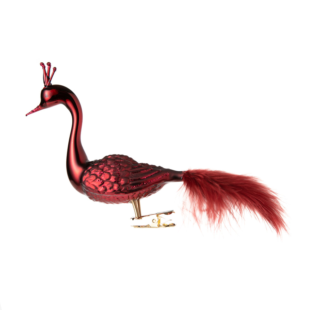 This elegant red swan is made from hand-blown glass in a family-owned studio. Its tail is made with real feathers and has a hand-painted finish.