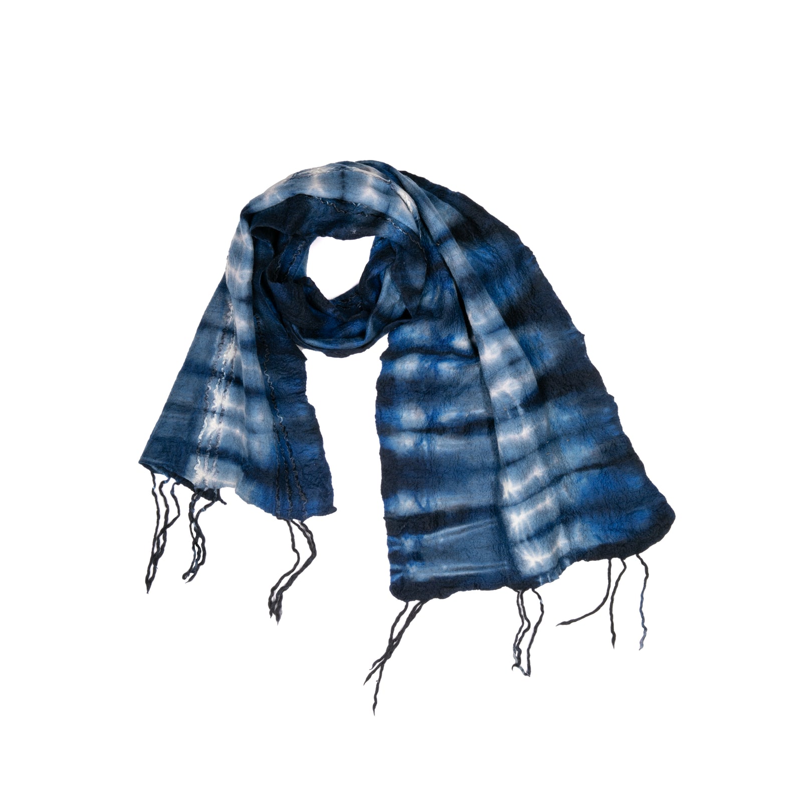 Wrap yourself in cozy vibes with this indigo wool scarf. Warm and chic, this scarf was hand-felted by artisans in South Africa and features a color and design inspired by the landscapes of that country. Material: 100% wool Made by South African artisans