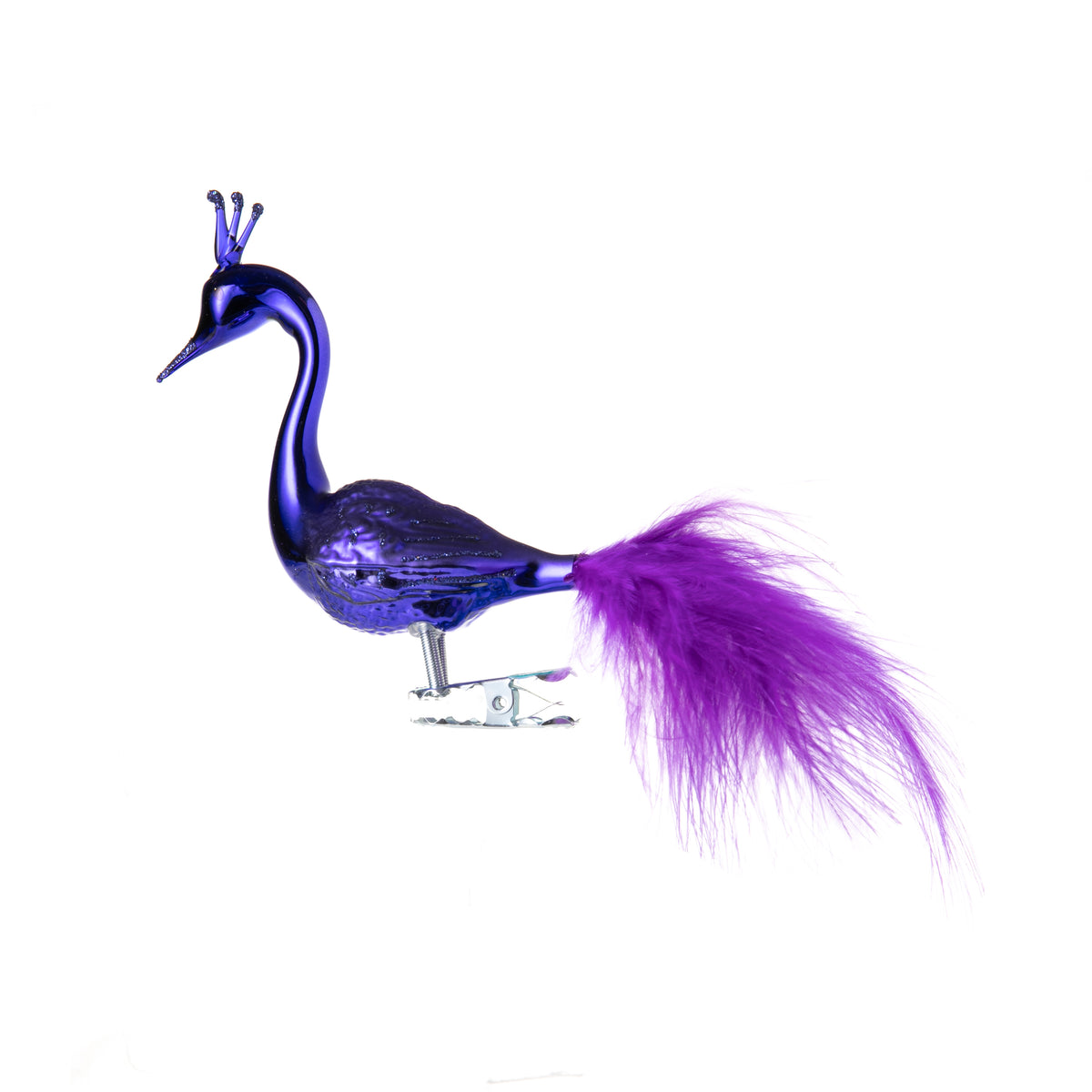 What could be more regal than a sparkling purple Swan! It is made from hand-blown glass in a traditional family-owned studio in Limbach, Germany.  Its tail is delicately trimmed with real feathers, and it has a highly detailed, hand-painted finish.  Attaches with a strong clip Dimensions approx: 5&quot; long x 3.3&quot; height.
