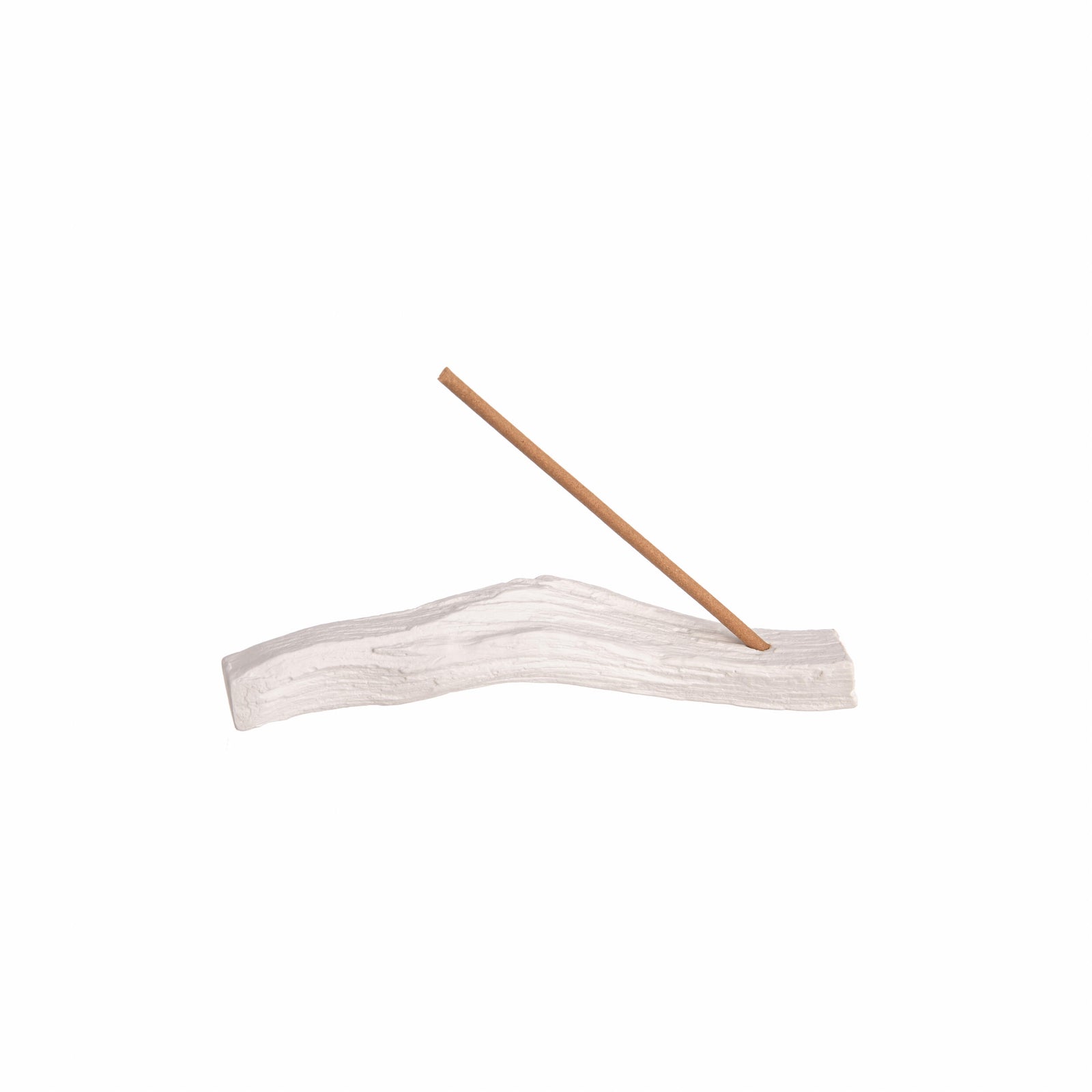 White branch-shaped incense holder with an incense stick on a white background