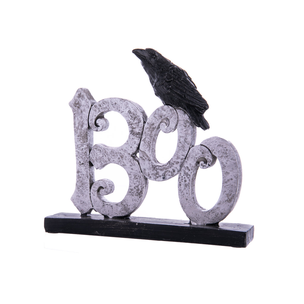 These cutout signs featuring a crow perched atop each word are perfect for Halloween. In 'Spooky', 'Wicked', and 'Boo', these tabletop signs evoke creepy and cute. Each variant is sold separately but would look adorable on shelves, a Halloween tablescape for a dinner party, or to spook-ify your desk. Material: Resin 