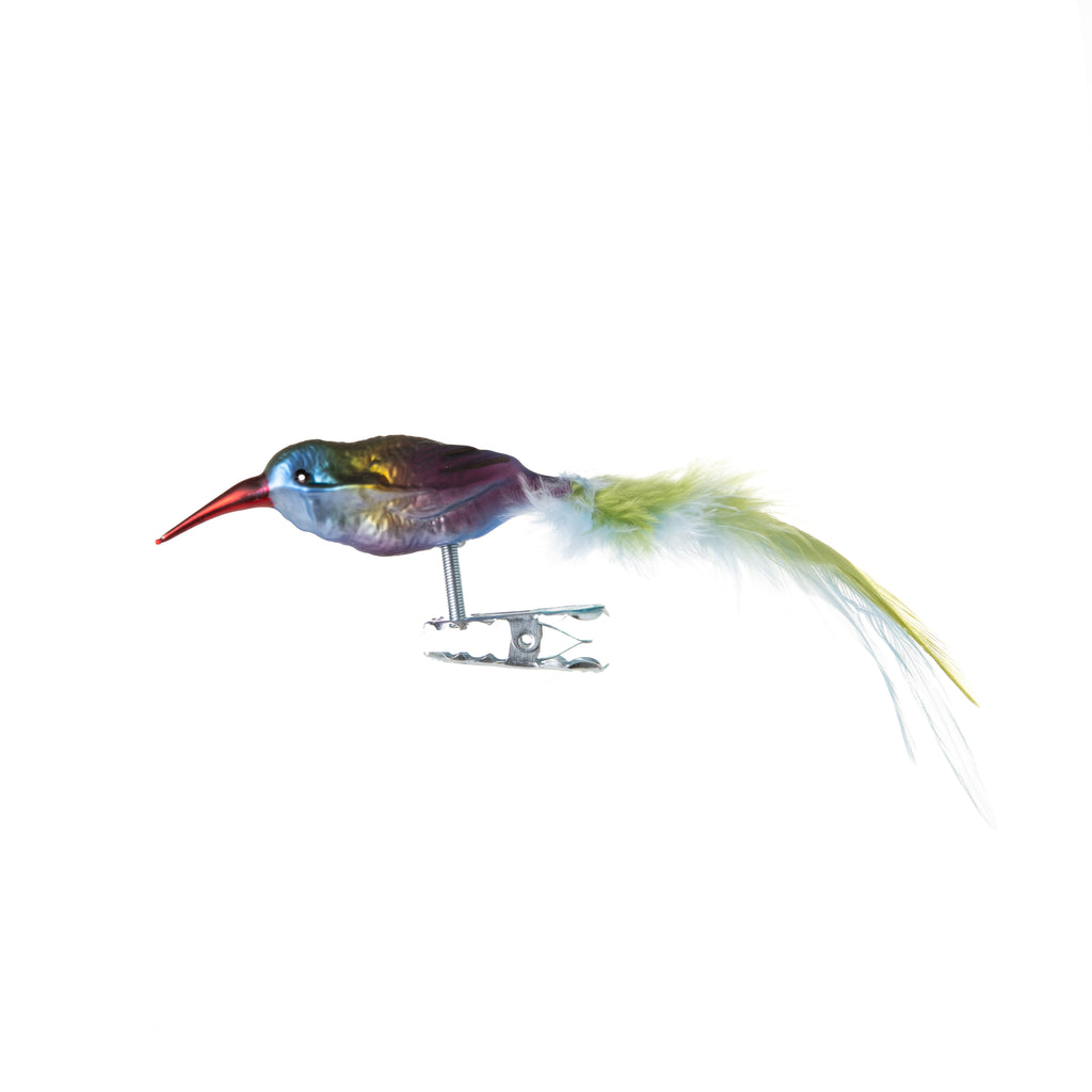 This adorable hummingbird is made from hand-blown glass in a family-owned studio. Its tail is made with real feathers and has a hand-painted finish.