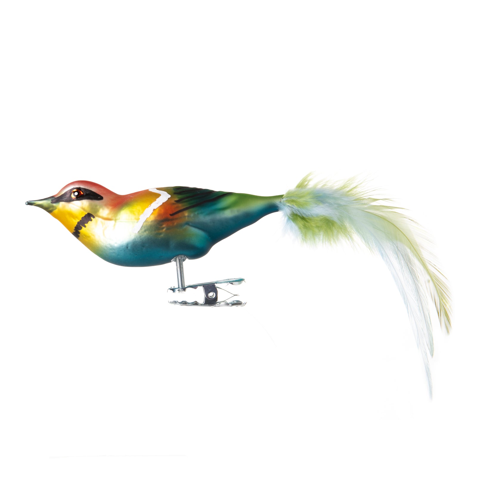 This colorful little Bee-Eater is made from hand-blown glass in a traditional family-owned studio in Limbach, Germany. Its tail is delicately trimmed with real feathers, and it has a hand-painted finish. Attaches with a strong clip Traditionally made in Germany Dimensions approx: 6" long x 1.5" height.