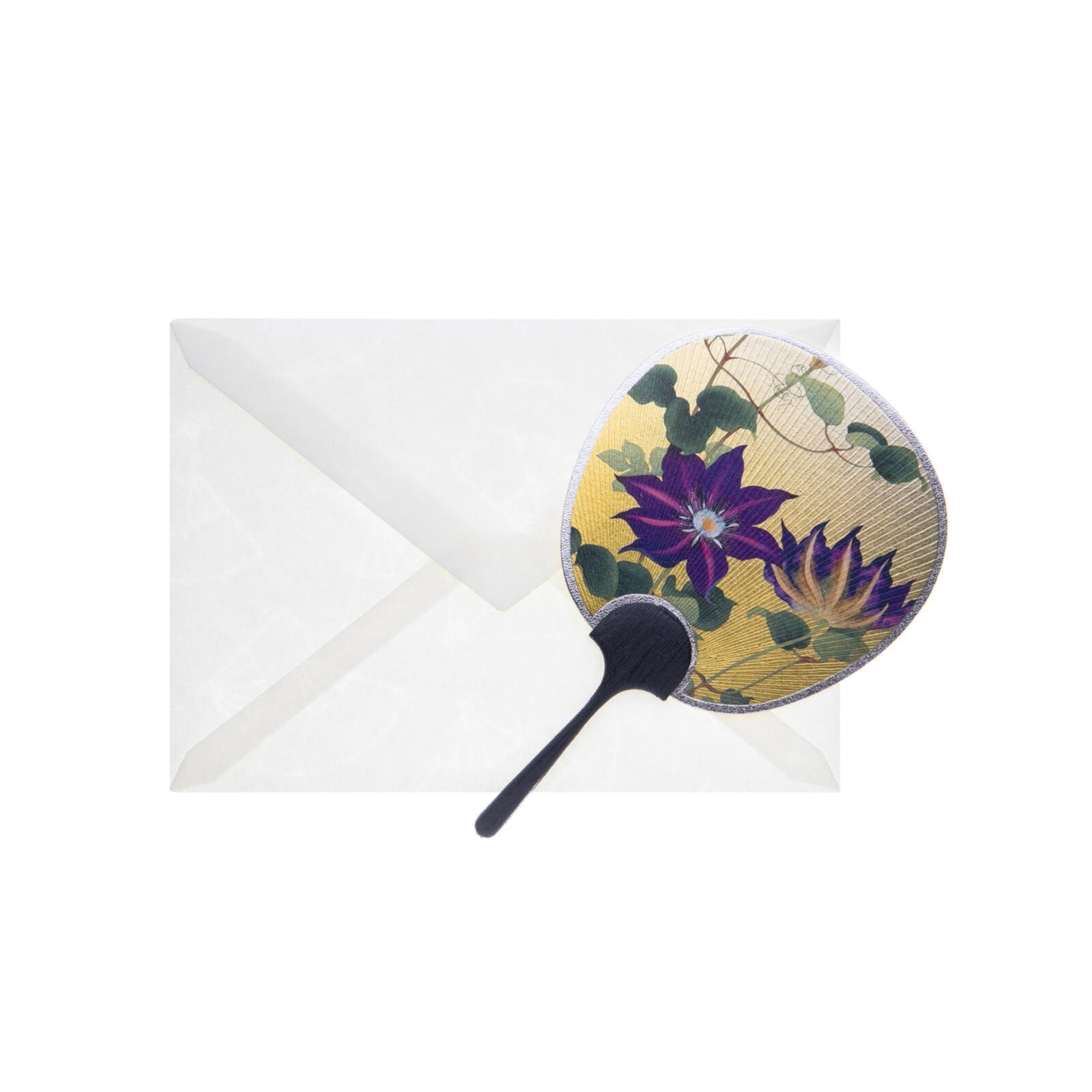 This charming greeting card is both pretty and practical. This authentic miniature Uchiwa Japanese fan is beautifully decorated with two striking, deep purple passion flowers, on a gleaming gold base. The reverse is blank for you to write your own message. The real wooden handle adds a lovely and luxe finishing touch. The fan is small enough to pop into your purse, but large enough to create a pleasant breeze.
