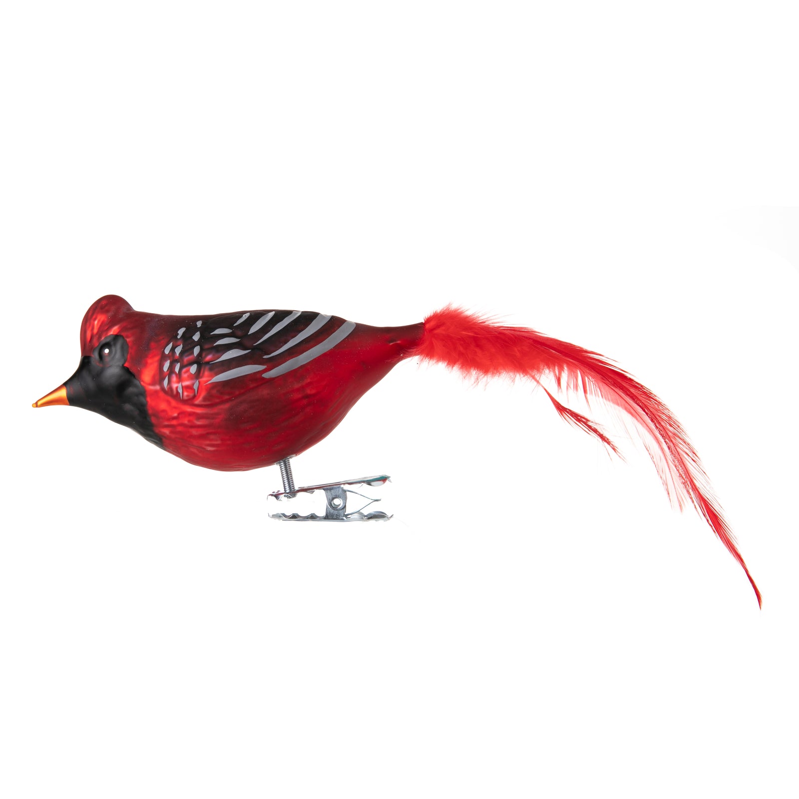 This festive red cardinal is made from hand-blown glass in a family-owned studio. Its tail is made with real feathers and has a hand-painted finish.