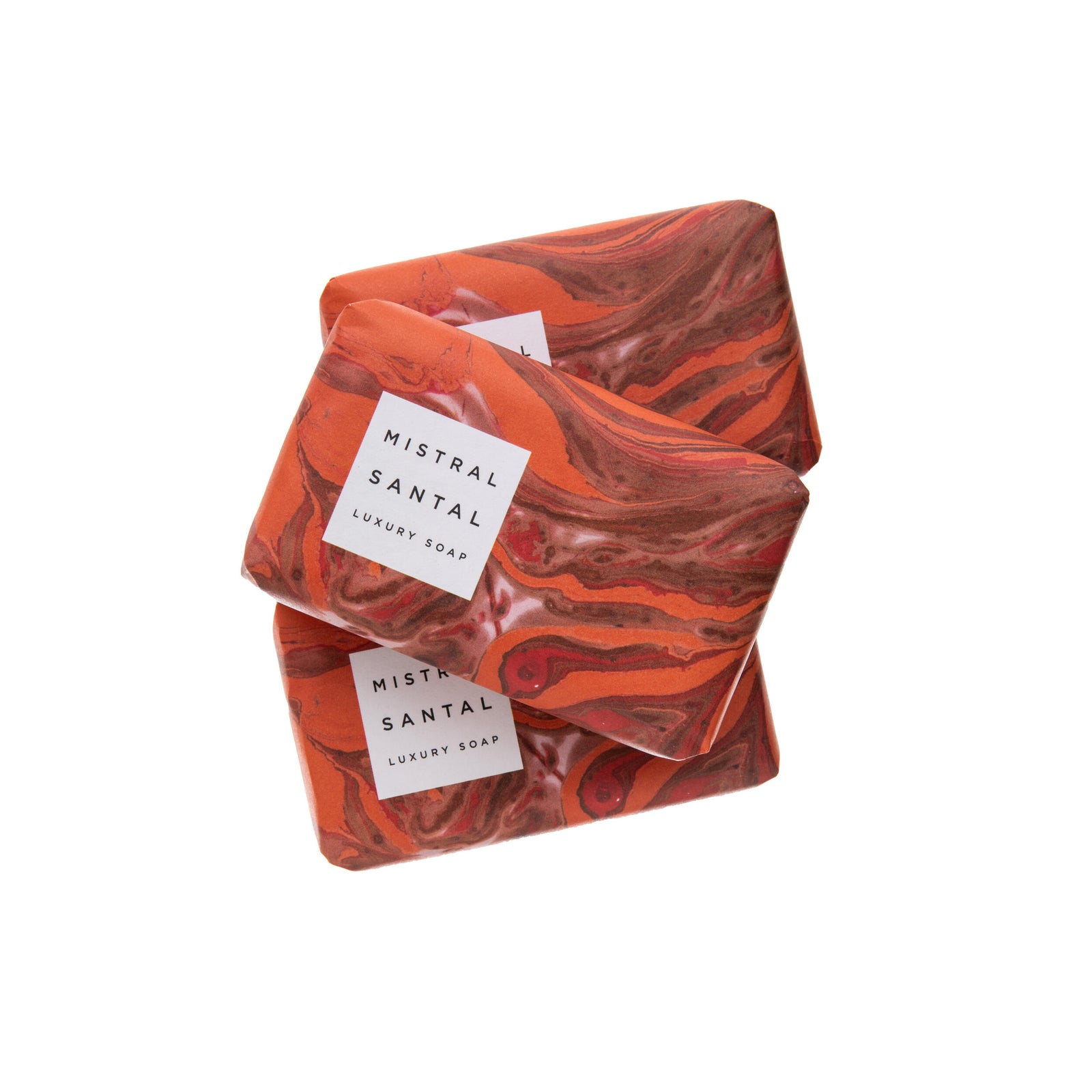 Marbled red and orange soap bar with 'Mistral Santal' label on a white background