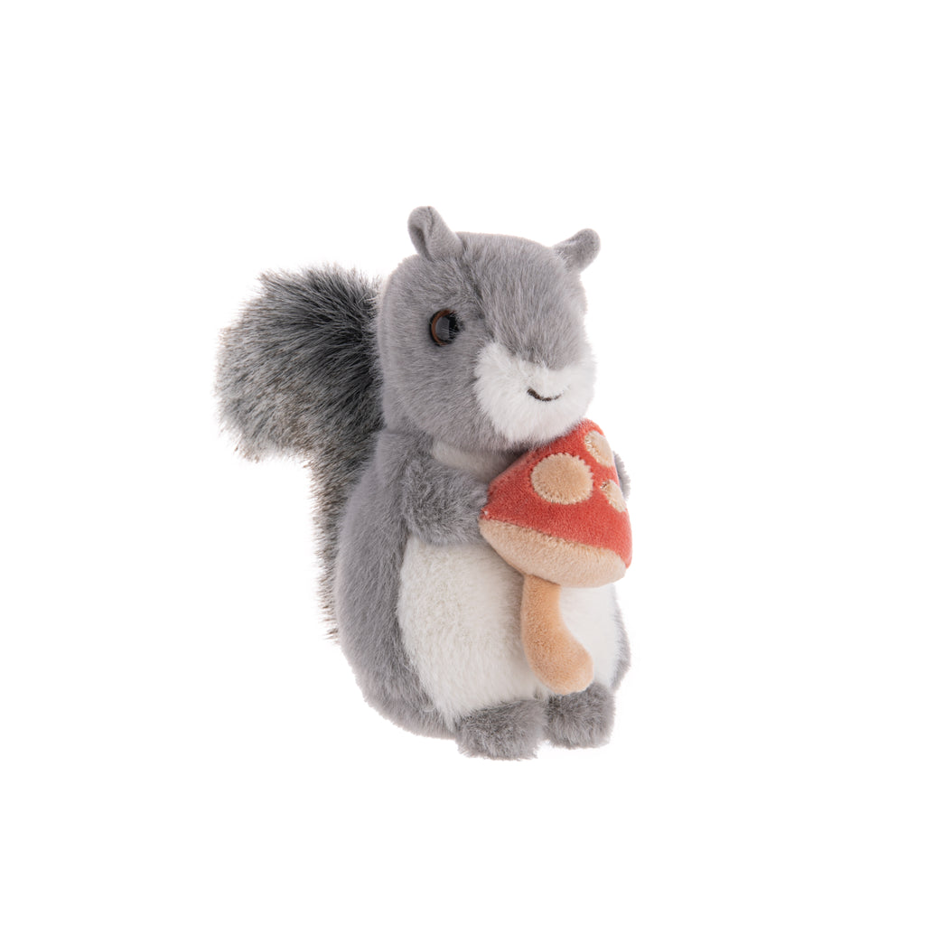 This plush Squirrel with Mushroom is so cute, it makes us want to go harvesting mushrooms immediately. With grey fur, a salt and pepper tail, and a whimsical red mushroom, this plush buddy is happy to show off his new find.  Dimensions: 4.5" x 3.5" x 5.75" Material: Polyester, Plastic Pellets Recommended age: 2+