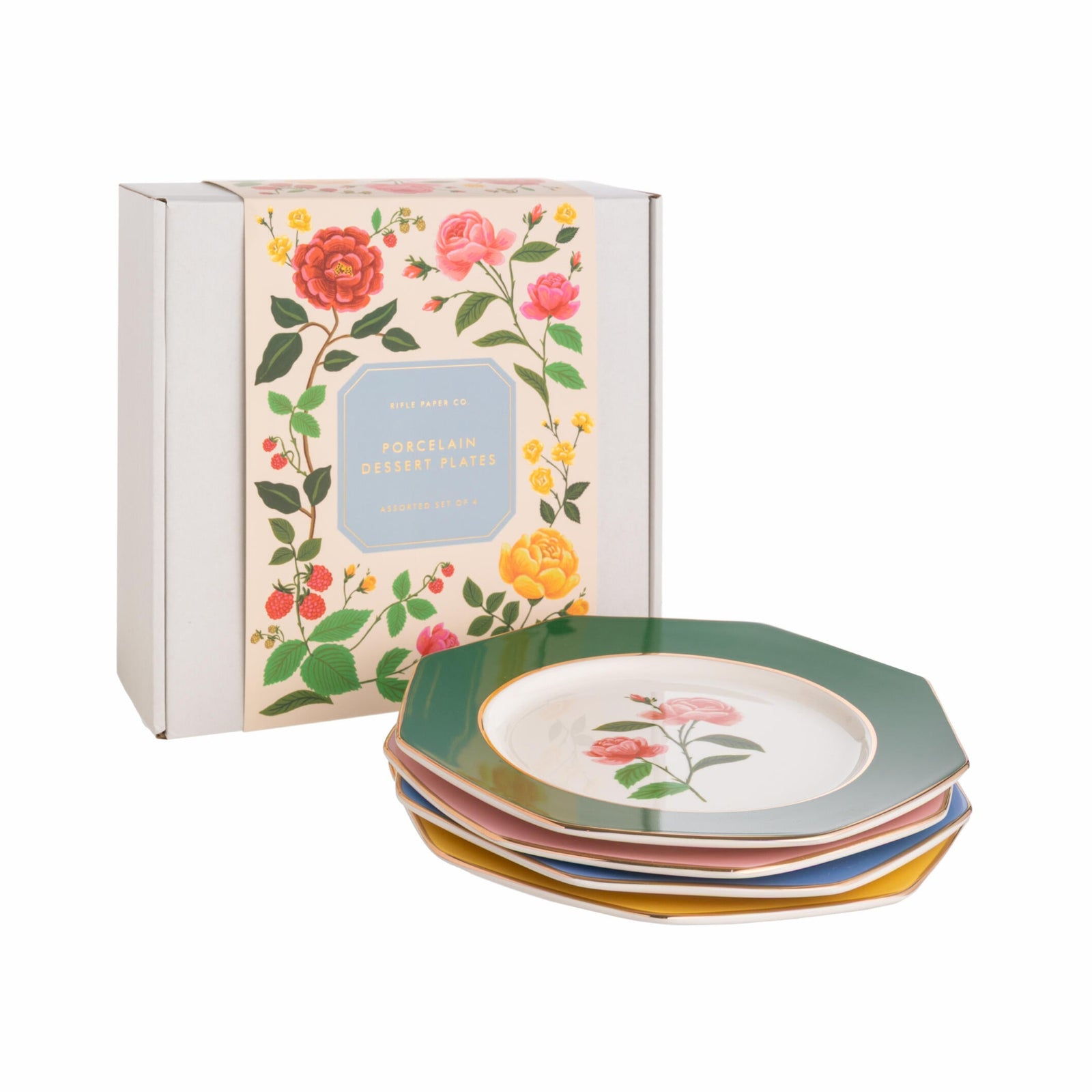 Set of floral ceramic plates with matching box on a white background