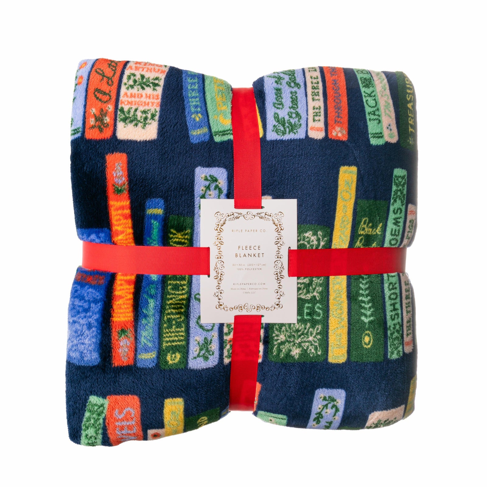 Folded fleece blanket with book design and red binding on a white background
