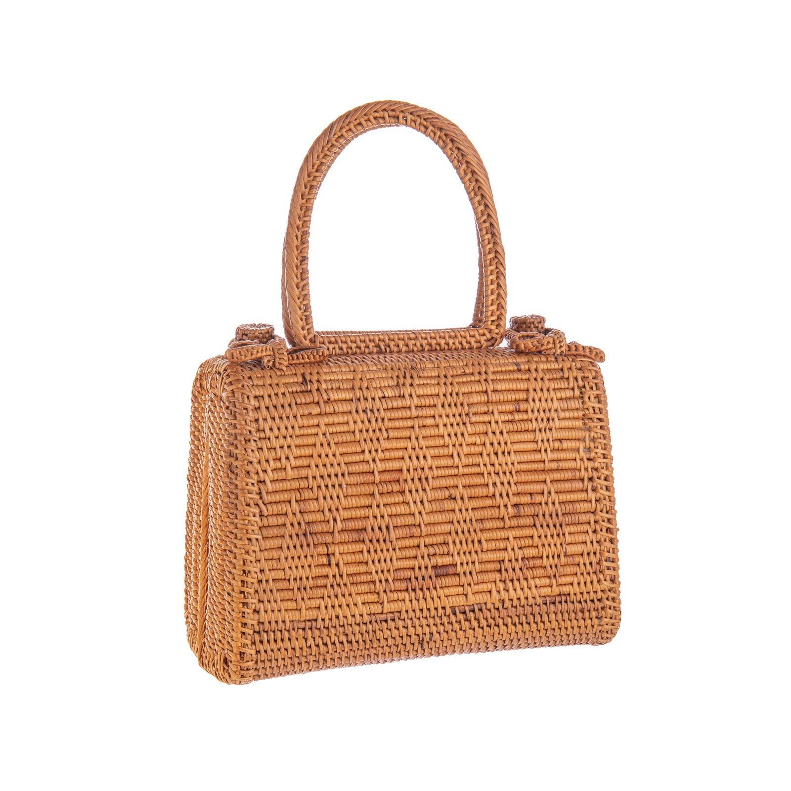 A woven rattan handbag with a brown color, featuring two bow clasps on top for closure, and a Batik print lining on the inside. It has a leather strap and hardware for handling.