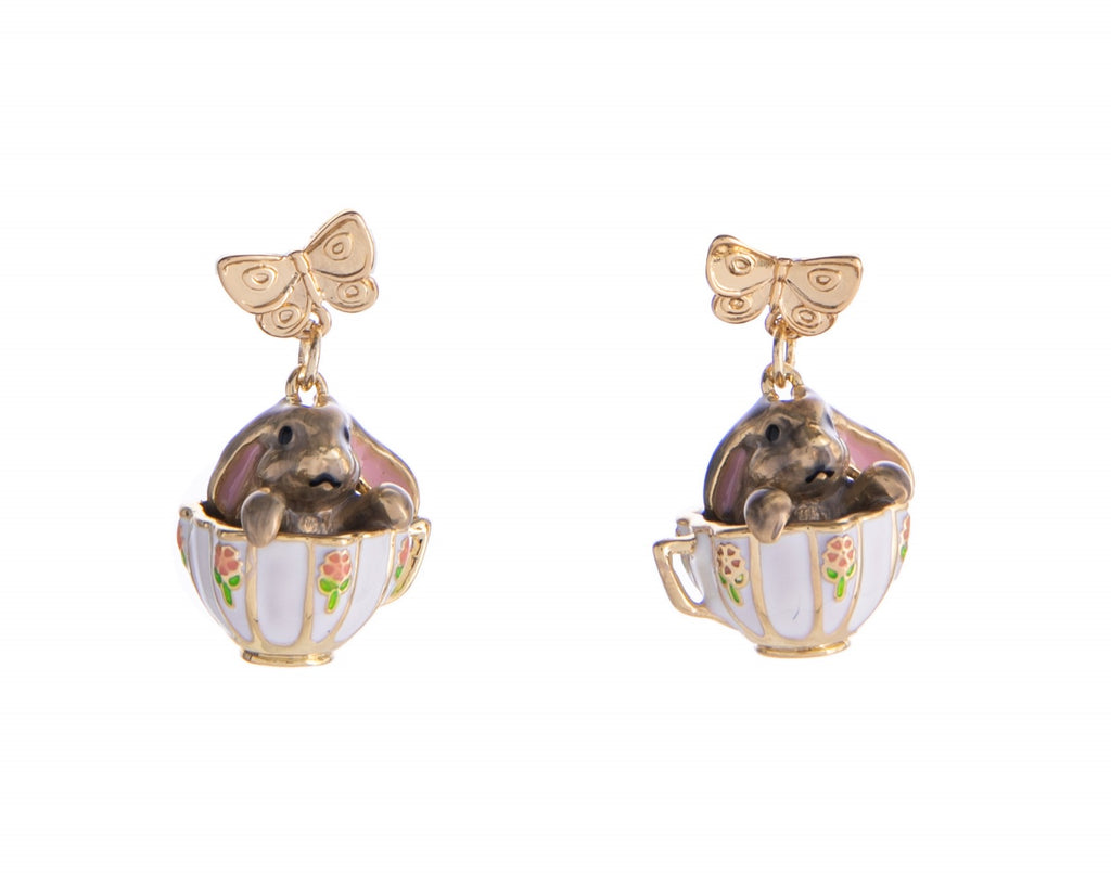 Don’t miss out on these adorable earrings—perfect for any tea or garden party! The delightful floral details on the teacup, paired with the cute bunny peeking out, make these earrings a whimsical and fun accessory that’s sure to turn heads and spark compliments. Gold-plated brass, enamel Approximately 1" L. Stud post.