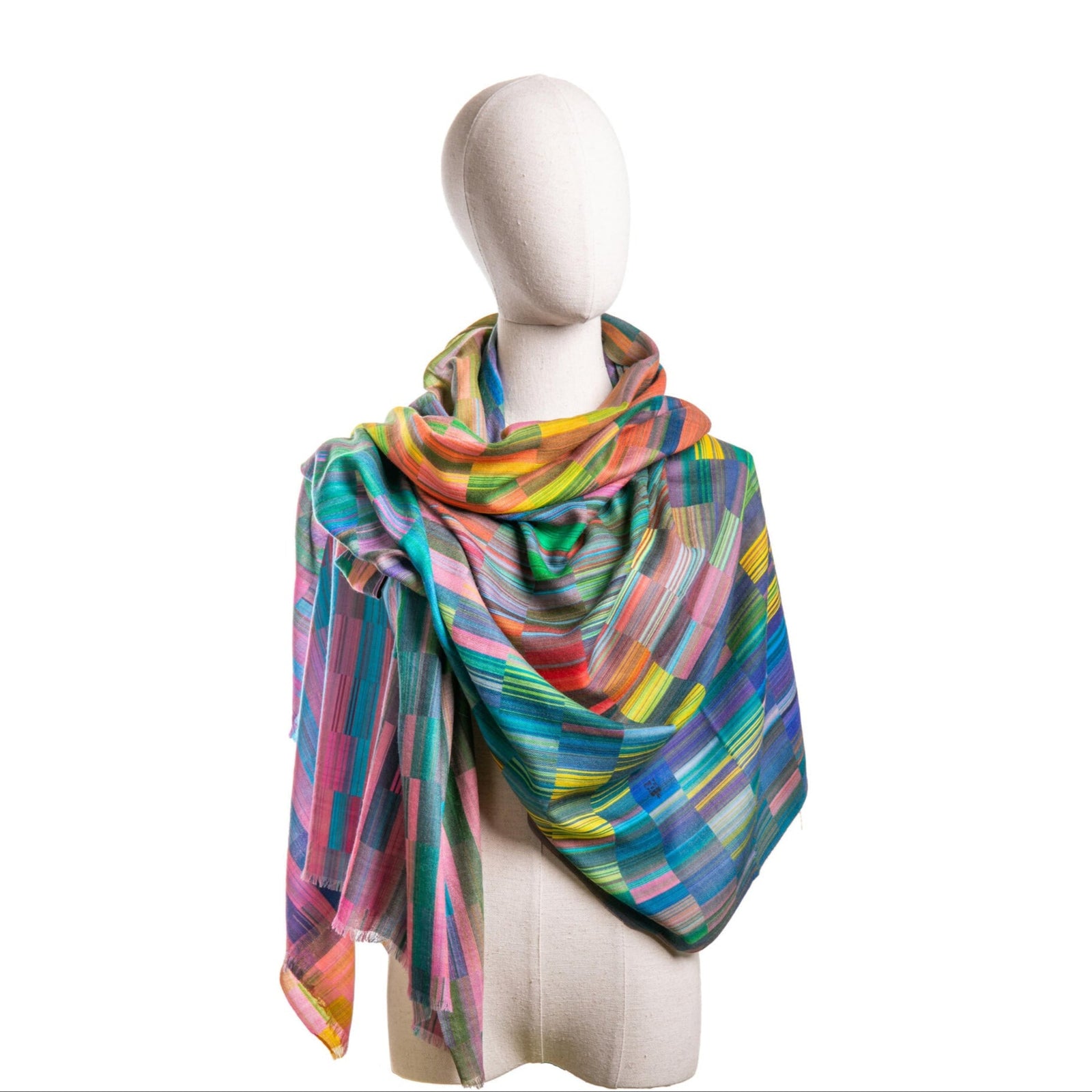 Mannequin wearing a colorful scarf on a white background