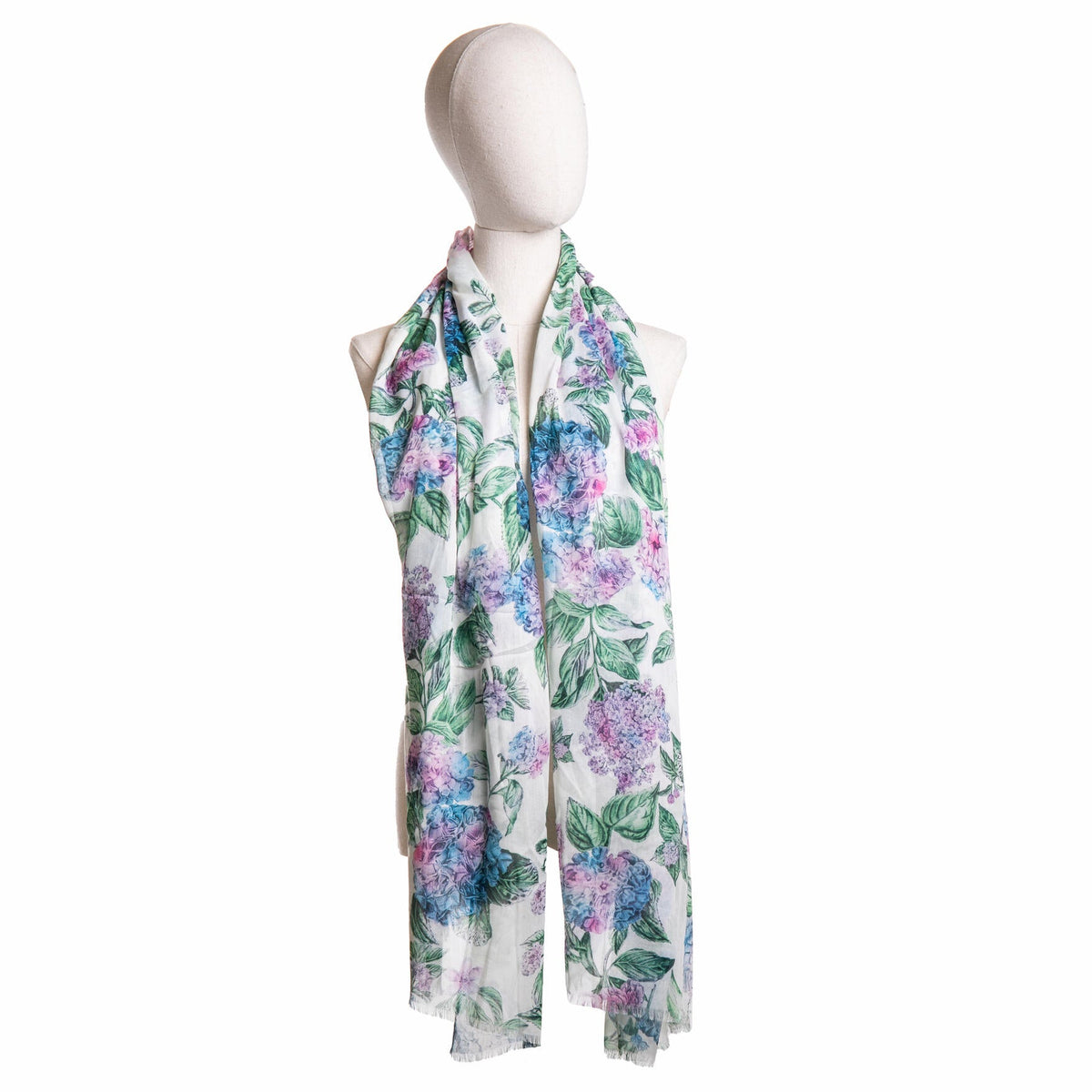 Floral scarf on a mannequin against a white background