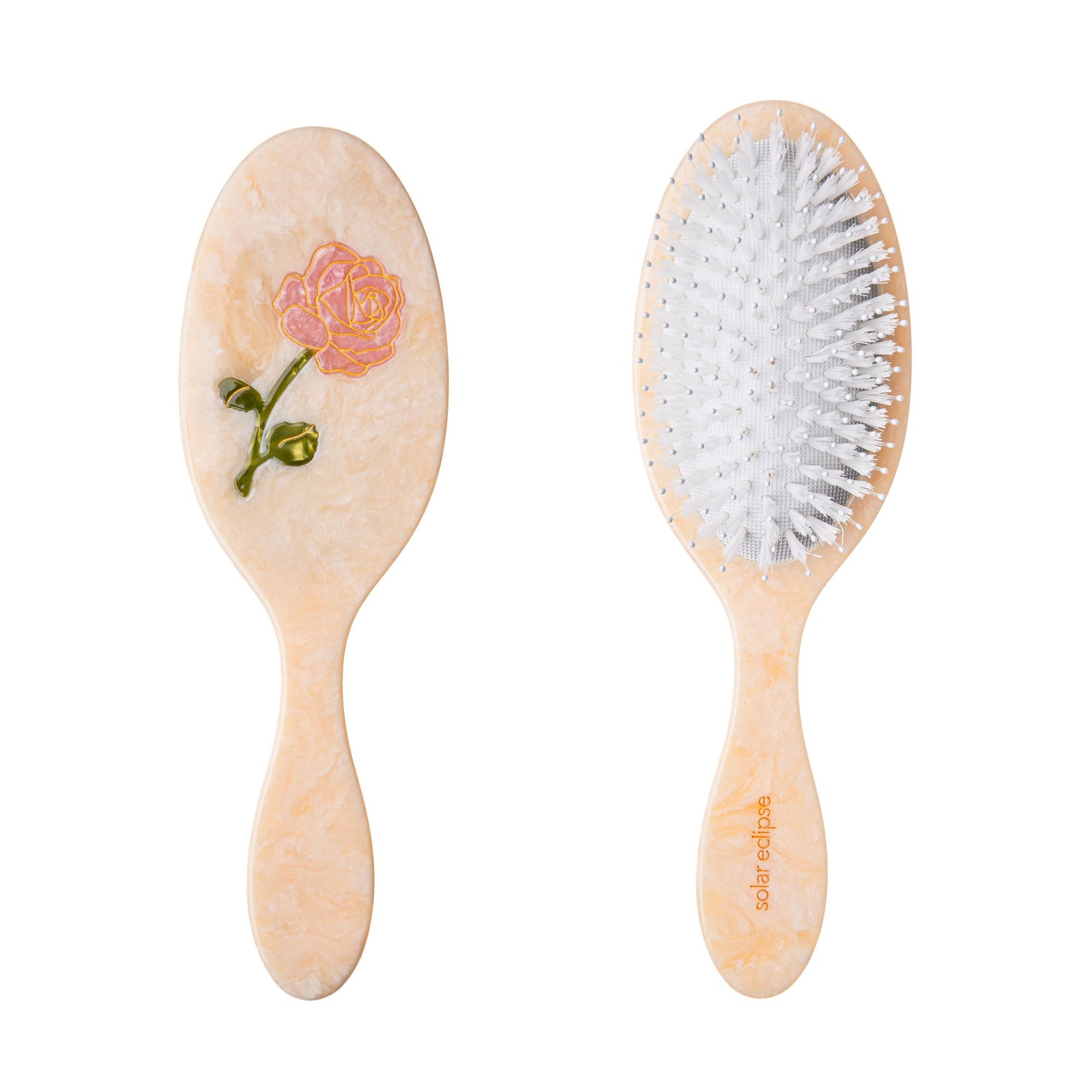 This delightful hairbrush is made of individually cut and formed eco-friendly cellulose acetate. The rose stem design is individually hand-painted with gold metallic accents. This 2-in-1 perfect daily brush is designed for all hair types and textures. It has two types of bristles, so it can be safely used on wet and dry hair. Vegan boar-like bristles stimulate natural hair growth, evenly distribute natural oils, and smooth your hair.