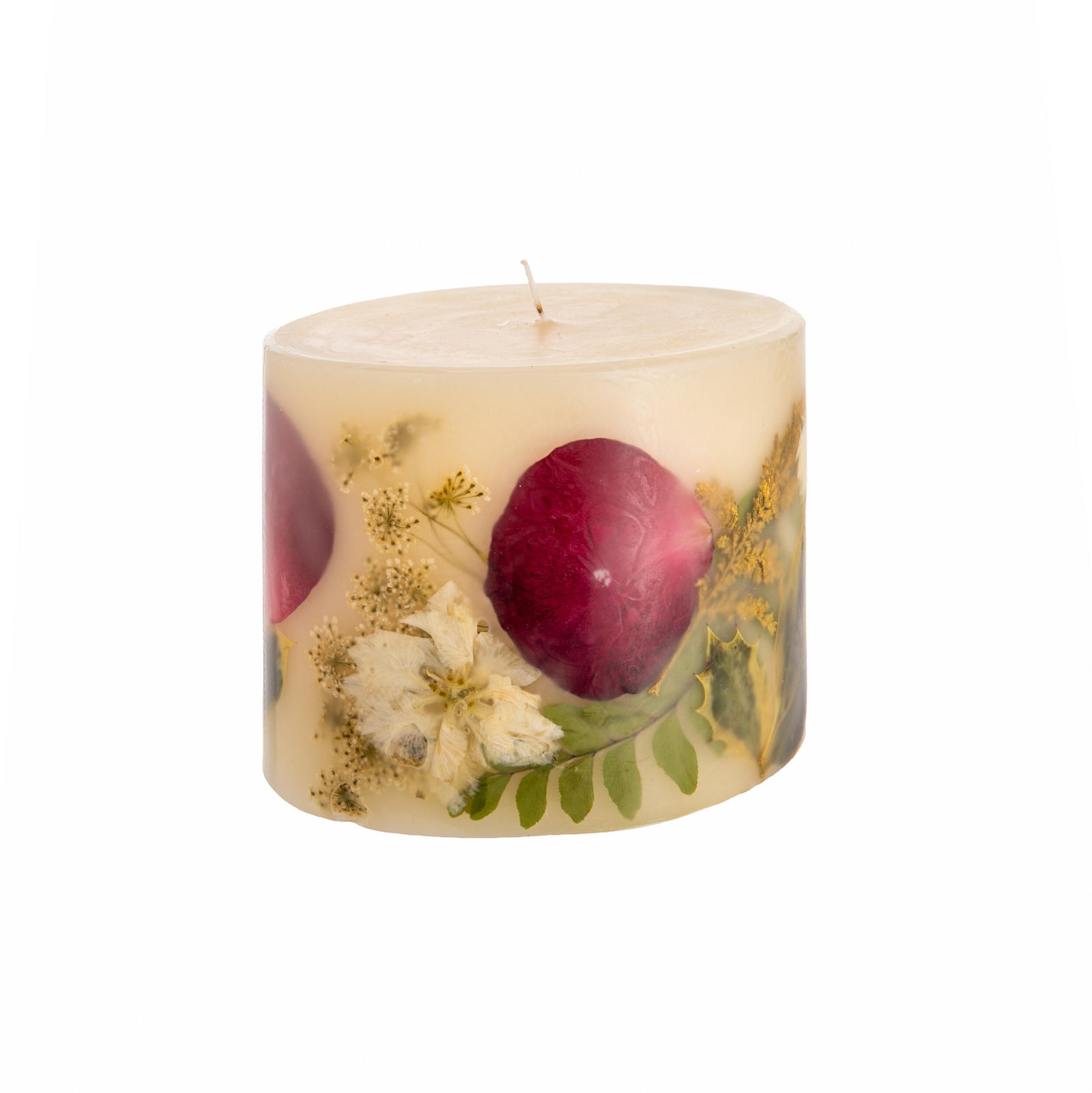 Decorative candle with embedded flowers and leaves on a white background