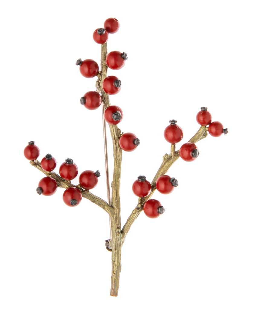 This fabulously festive brooch is cast in solid bronze with a hand-patina finish giving the 'branches' a gorgeous vintage style finish. The holly 'berries' are made from red jade beads, each carefully added by hand. Hand cast and finished Materials: bronze, red jade Dimensions: 3" x 2" Made in the U.S.A