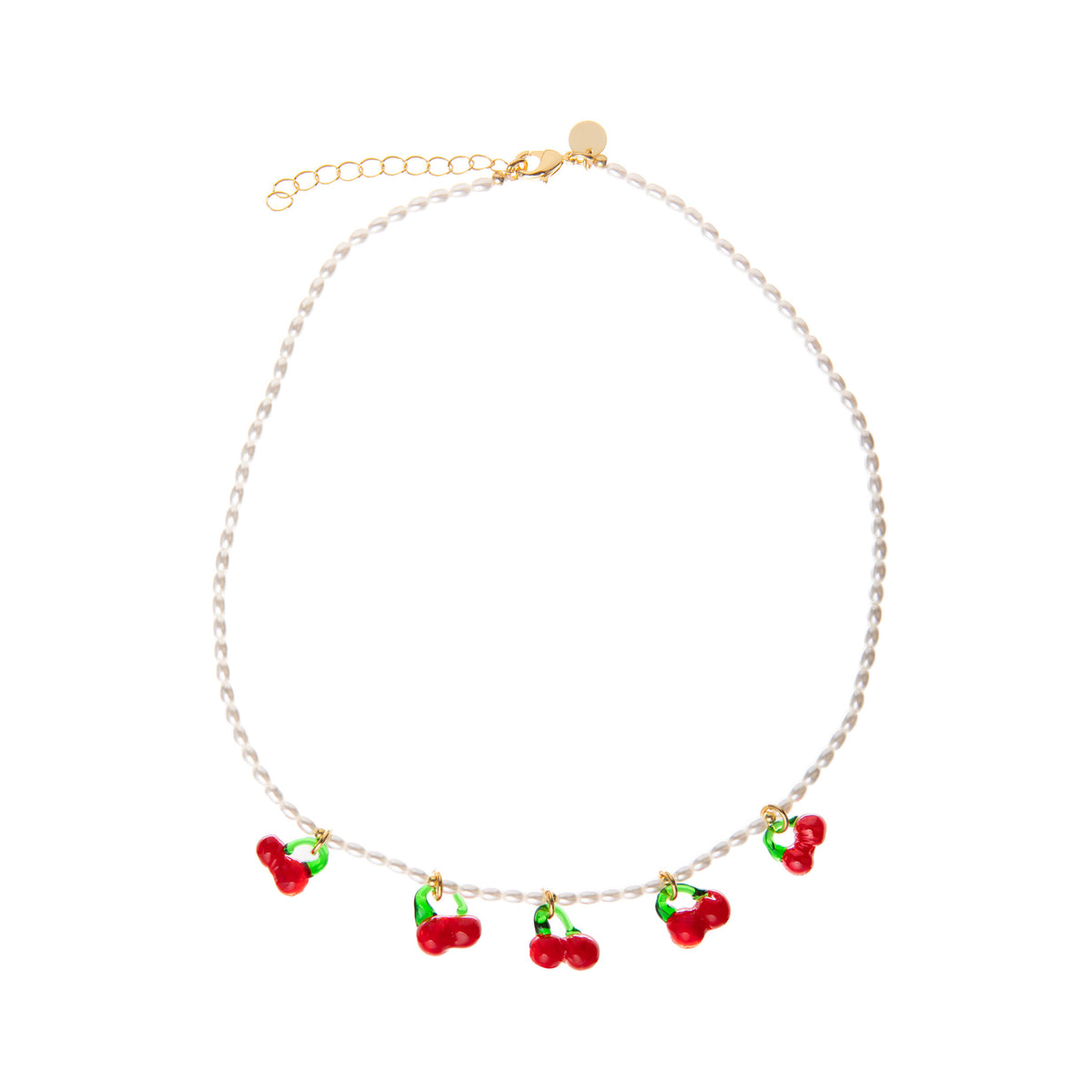 Pearl necklace with red and green glass cherry charms on a white background.