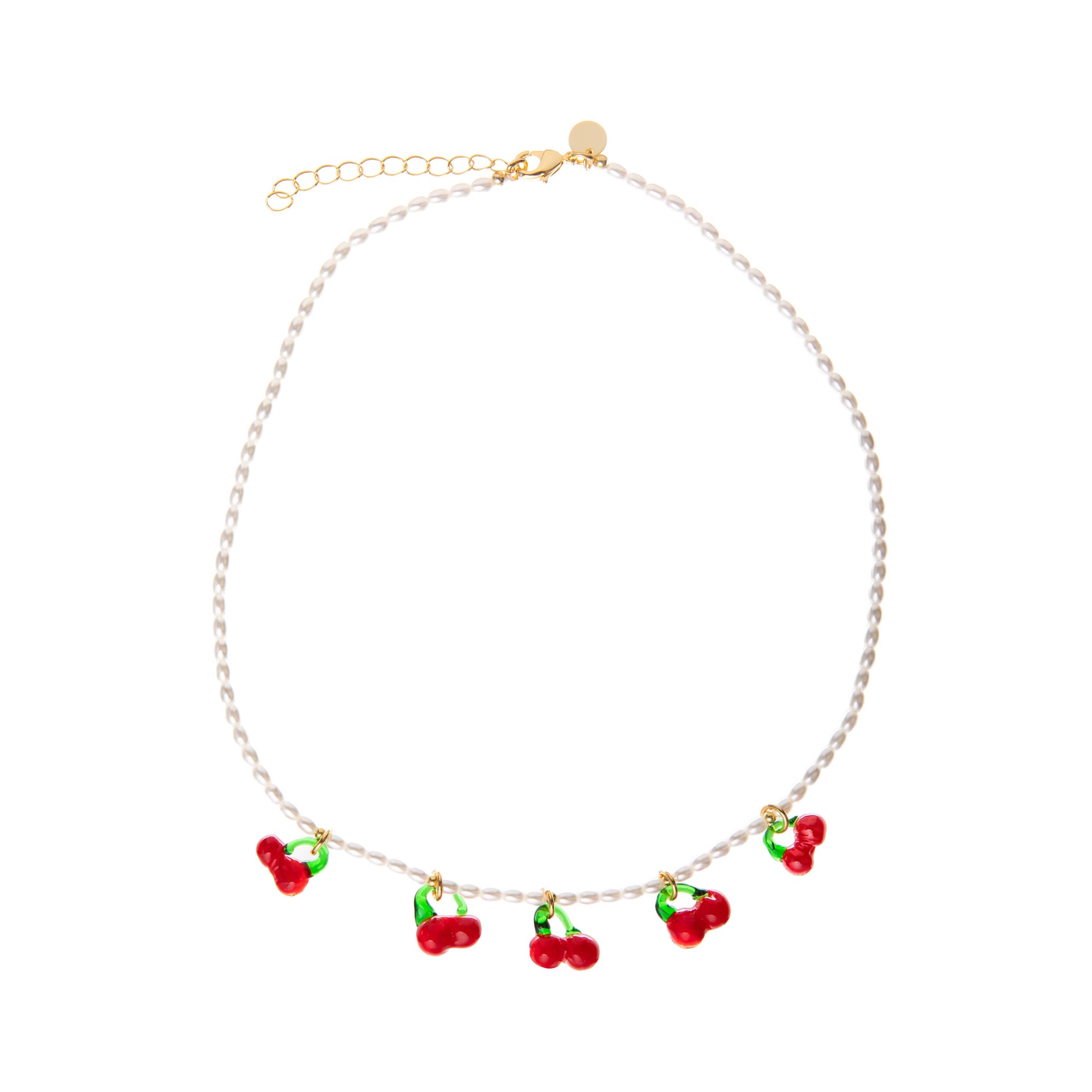 Pearl necklace with red and green glass cherry charms on a white background.