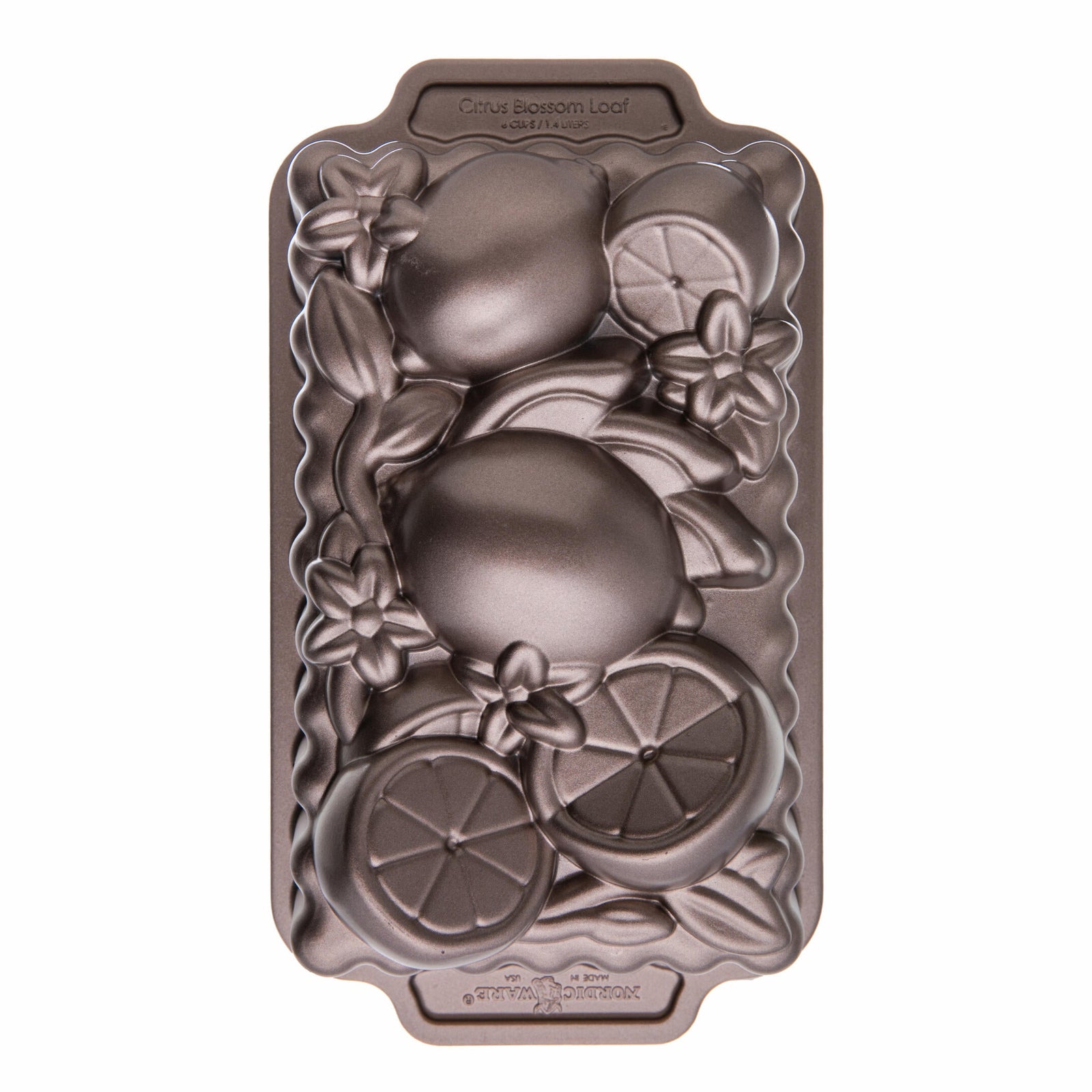 Decorative cake pan with fruit design on a white background