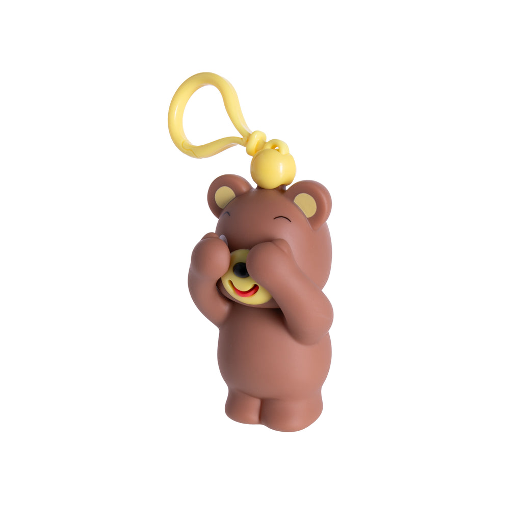 Squeeze this adorable bear and watch how it sticks its tongue out and plays peek-a-boo! The bear makes also makes a silly noise for the ultimate fun! Also features a clip to hang on bags or keys. Recommended ages: 18 mo.+ Material: Plastic Dimensions: Approx. 6"H x 2.5"W x 2.25"L