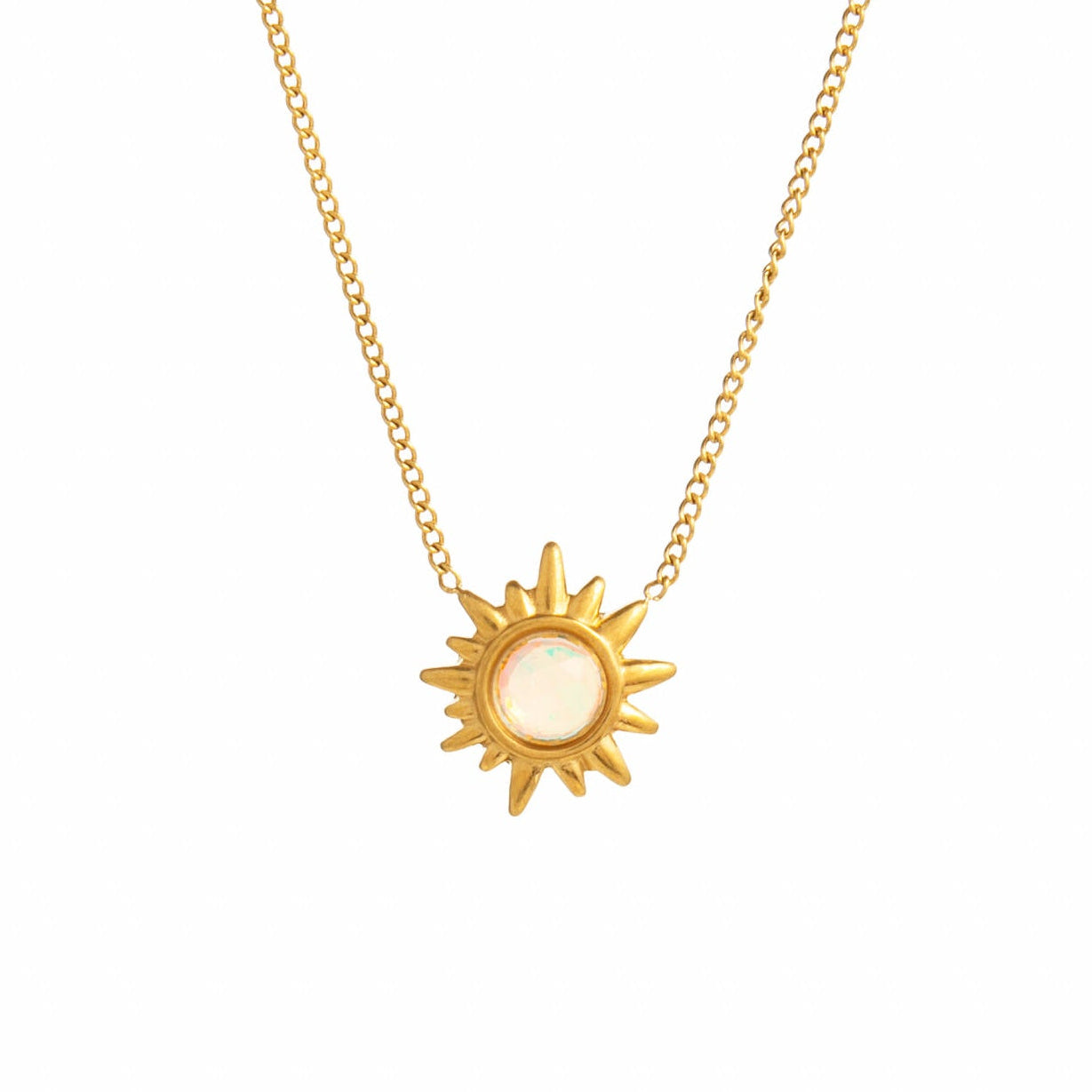 Gold sun-shaped pendant necklace on a white background