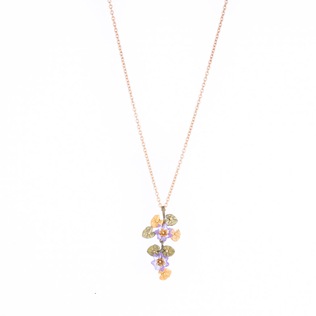 Inspired by Claude Monet's depictions of his lily pond in Giverny, France, this delicate and detailed necklace is made from cast bronze, with a 24k gold finish. Cast bronze with a 24k gold finish. Cast glass accents. Handmade in the USA by designer Michael Michaud.