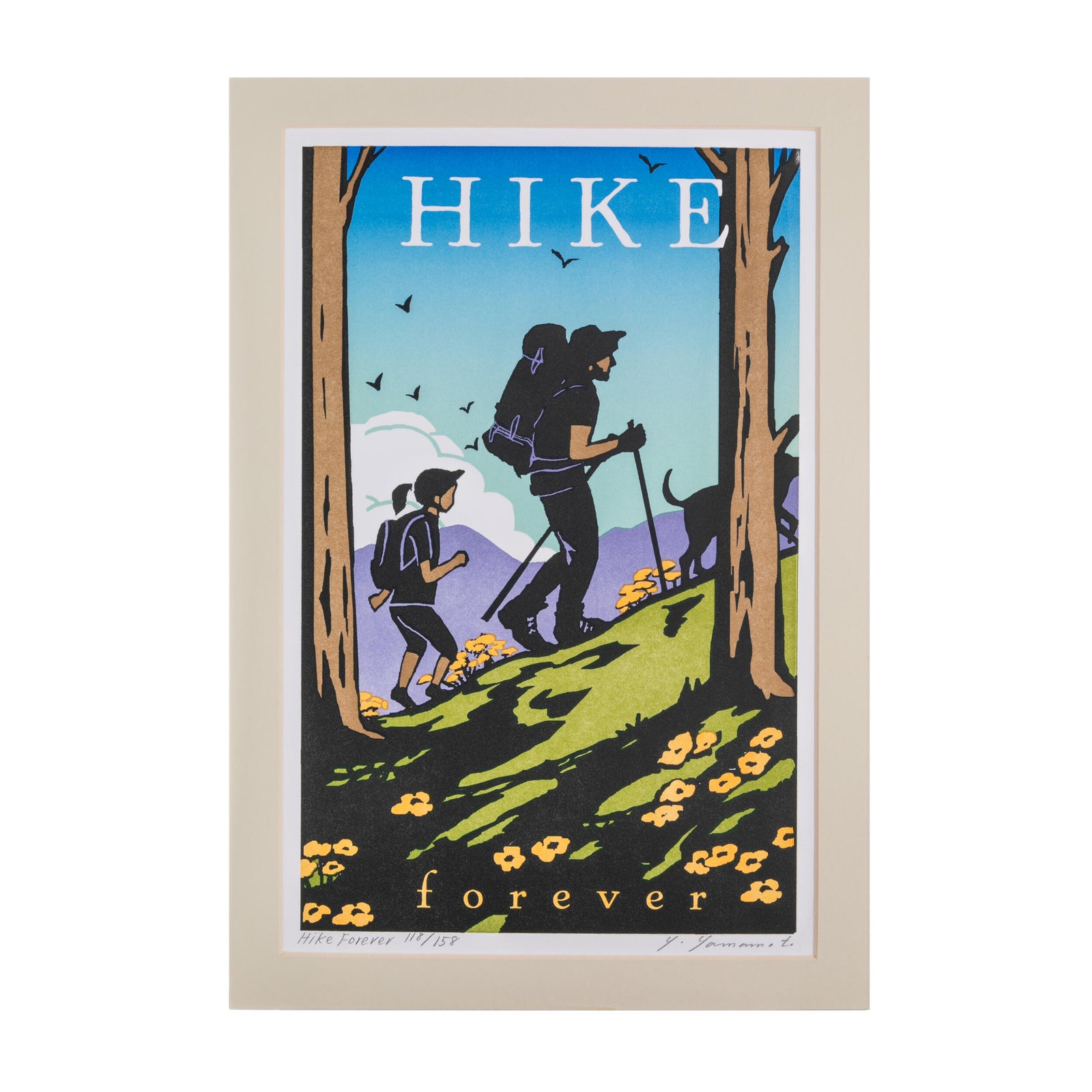 Framed artwork of hikers on a trail with 'HIKE forever' text.