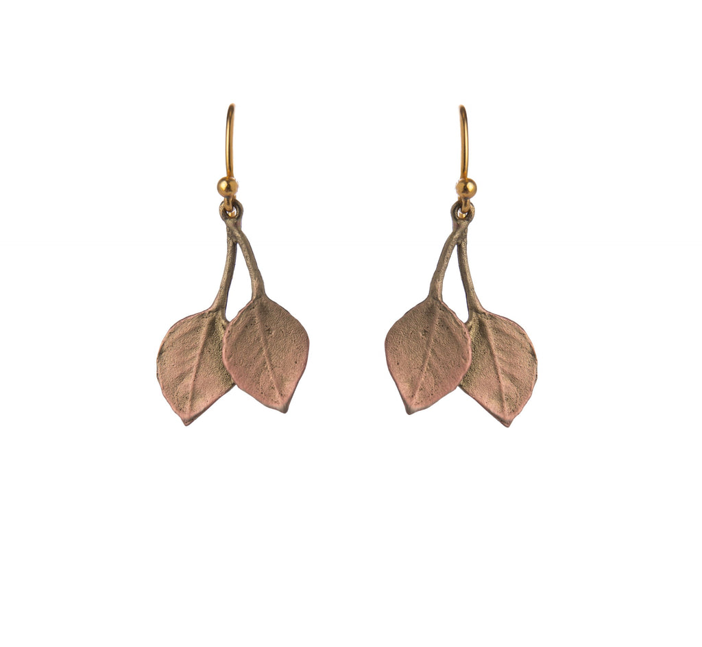 These pretty earrings feature two dainty leaves. They are hand cast in bronze and finished with 24kt gold plating with subtle copper highlights giving them a 3-dimensional, multi-tone appearance. Materials: bronze, 24kt gold plating, copper. Ear wires: 24kt gold plated sterling silver. Dimensions: 0.93" x 0.61".