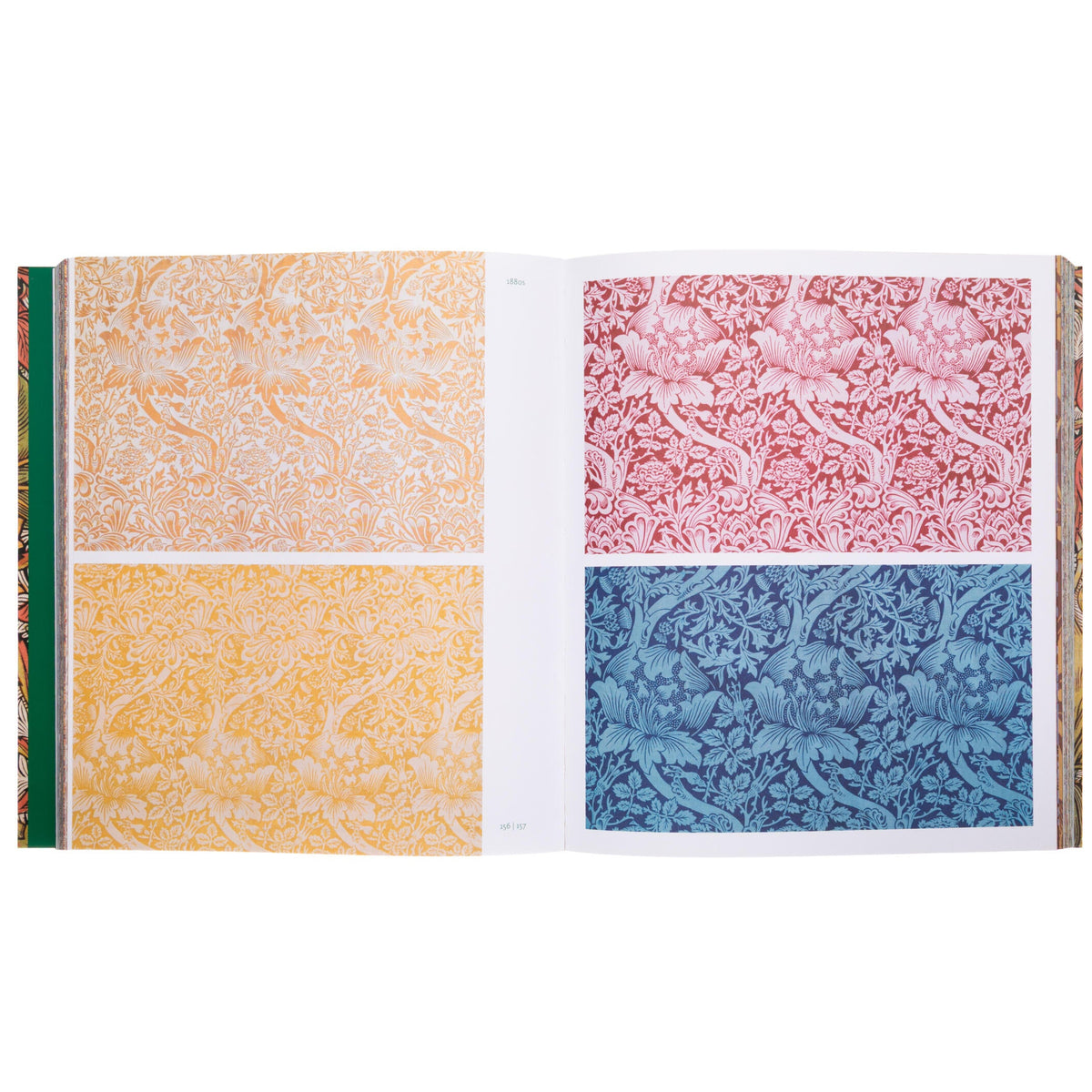 Open book displaying four different textured paper samples in orange, pink, blue, and green on a white background.
