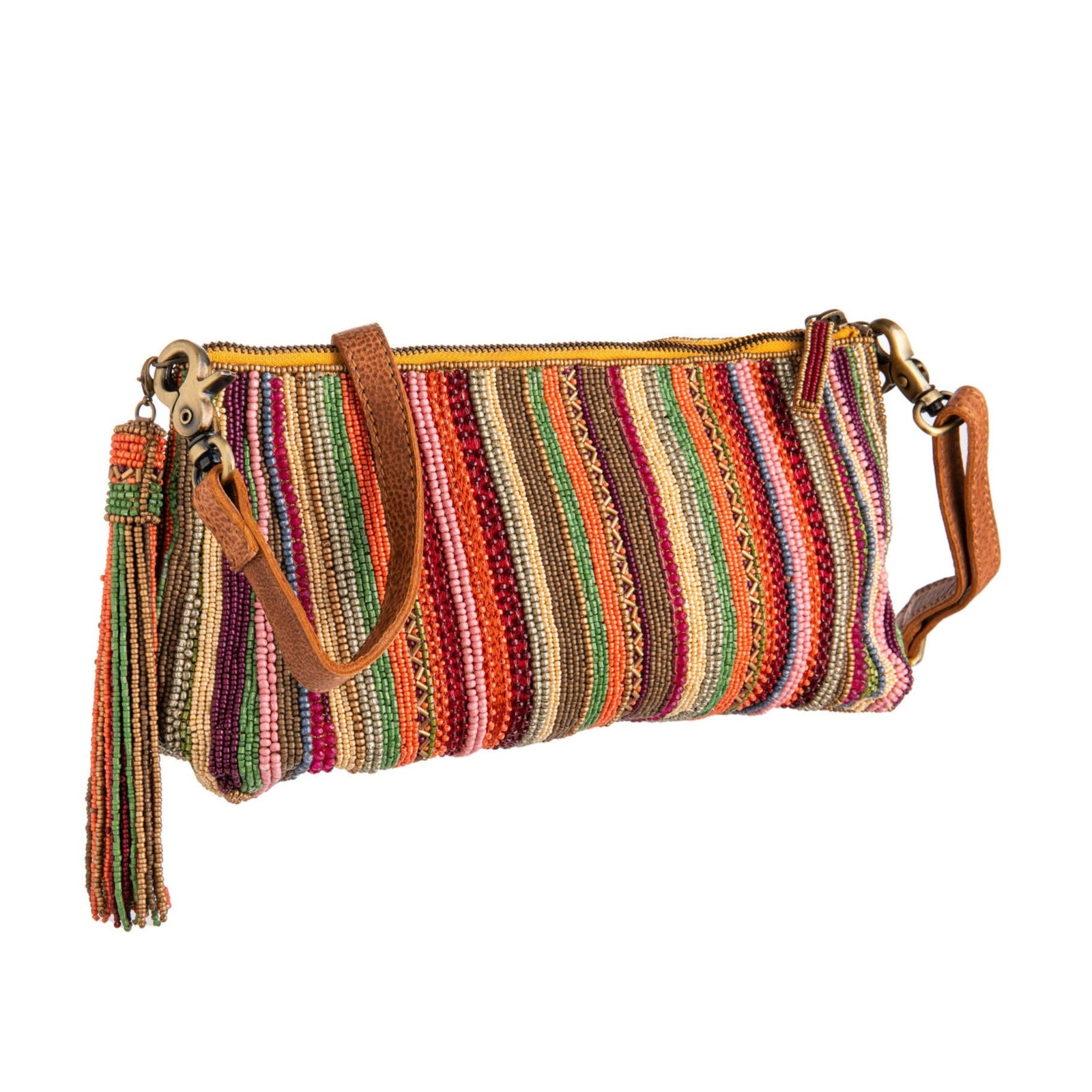 Multicolored striped handbag with brown leather straps on a white background