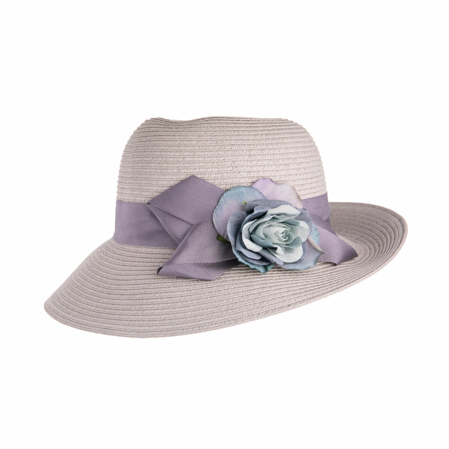 Straw hat with a purple ribbon and floral decoration on a white background