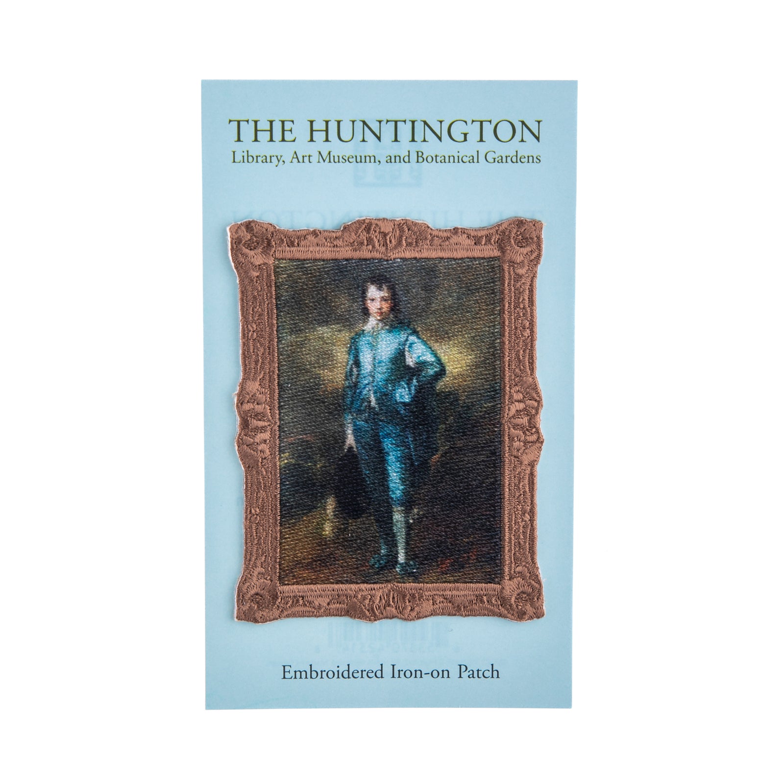 Embroidered iron-on patch with a portrait of The Blue Boy by Gainsborough on a light blue background, featuring 'The Huntington' branding.