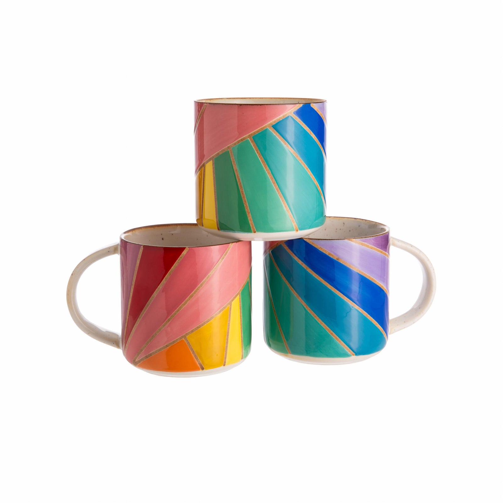 Three colorful mugs with geometric patterns on a white background