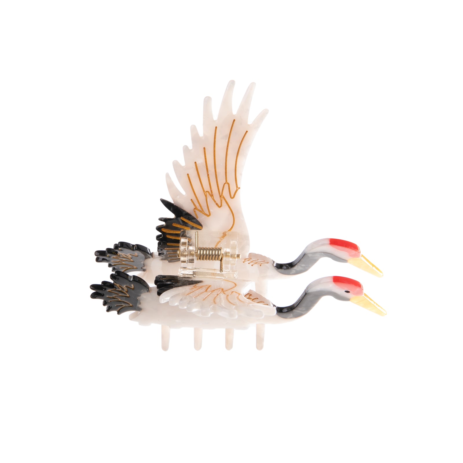 This fabulous hair clip features a majestic crane in full flight. This unique hair clip is hand finished and carefully crafted from cellulose acetate; an eco-friendly, biodegradable material made from recycled wood pulp. Dimensions: 4" x 3.5" Double-sided design. Eco-friendly cellulose acetate.