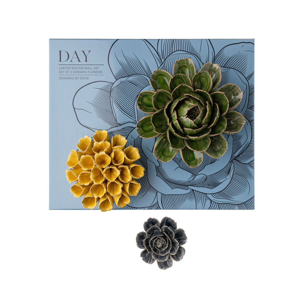 This stunning set of three ceramic flowers makes the perfect addition to your home decor. In green, yellow, and muted blue, the flowers have a glaze finish and look utterly realistic. Contains 3 ceramic flowers. Small flower - 3.5" Diameter, Medium - 5.5" Diameter, Large - 6" Diameter Keyhole on back for hanging.