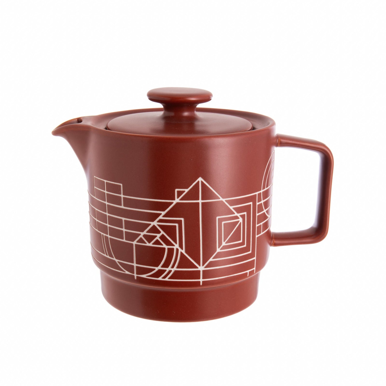 Red ceramic Frank Lloyd Wright design teapot with geometric design on a white background