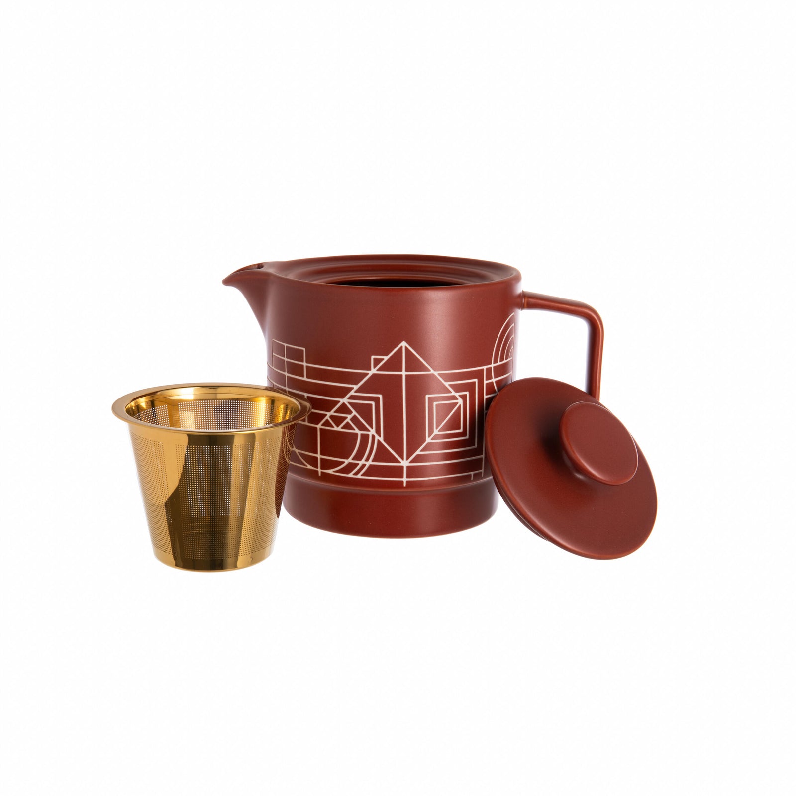 Red ceramic Frank Lloyd Wright design teapot with geometric design on a white background