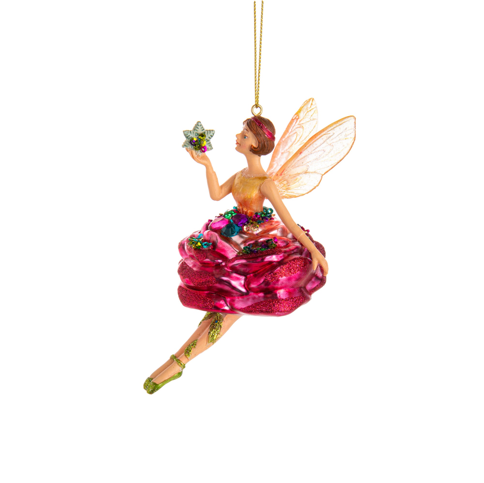 Decorative fairy ornament with a pink dress and wings, holding flowers, on a white background.