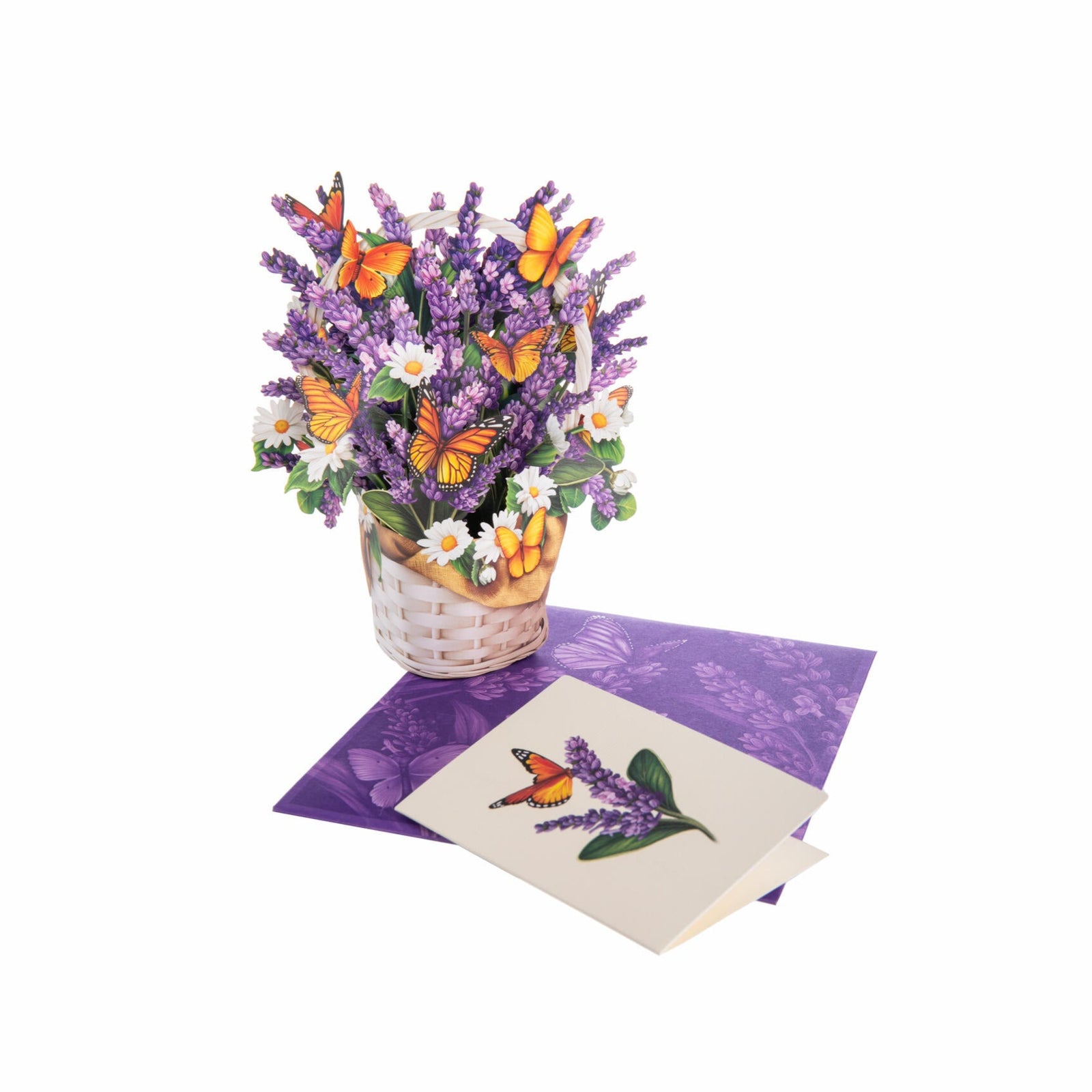 Inspired by the lavender fields of Provence, the Mini Lavender & Butterflies Pop-Up Card captures the essence of spring in a sophisticated yet charmingly petite form. Monarch butterflies flutter among delicate wildflowers, with each textured petal evoking a sense of tranquility and peace. The mini size captures its intricate beauty, making it a perfect balance of elegance and whimsy.