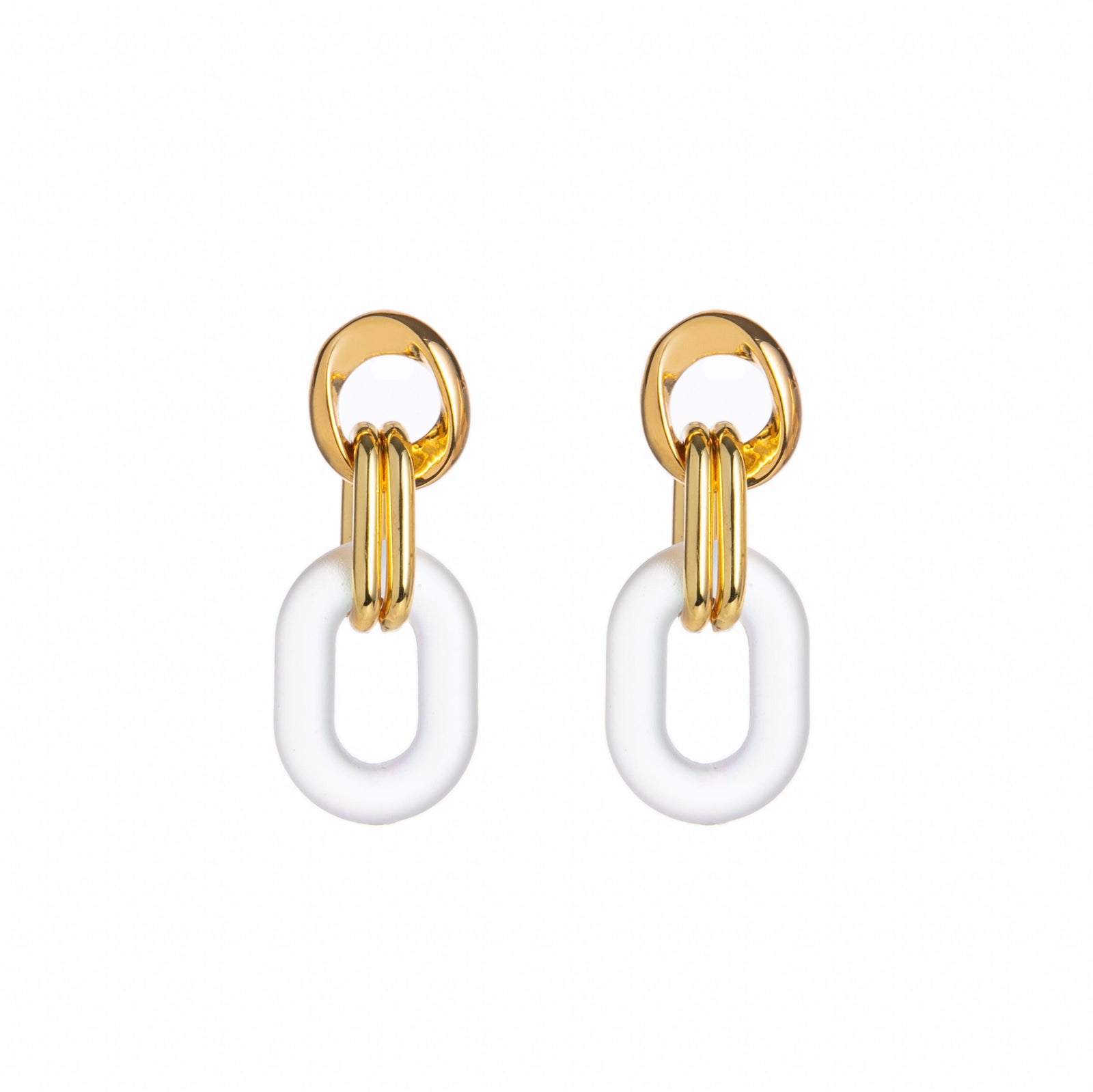 Gold and white hoop earrings on a white background