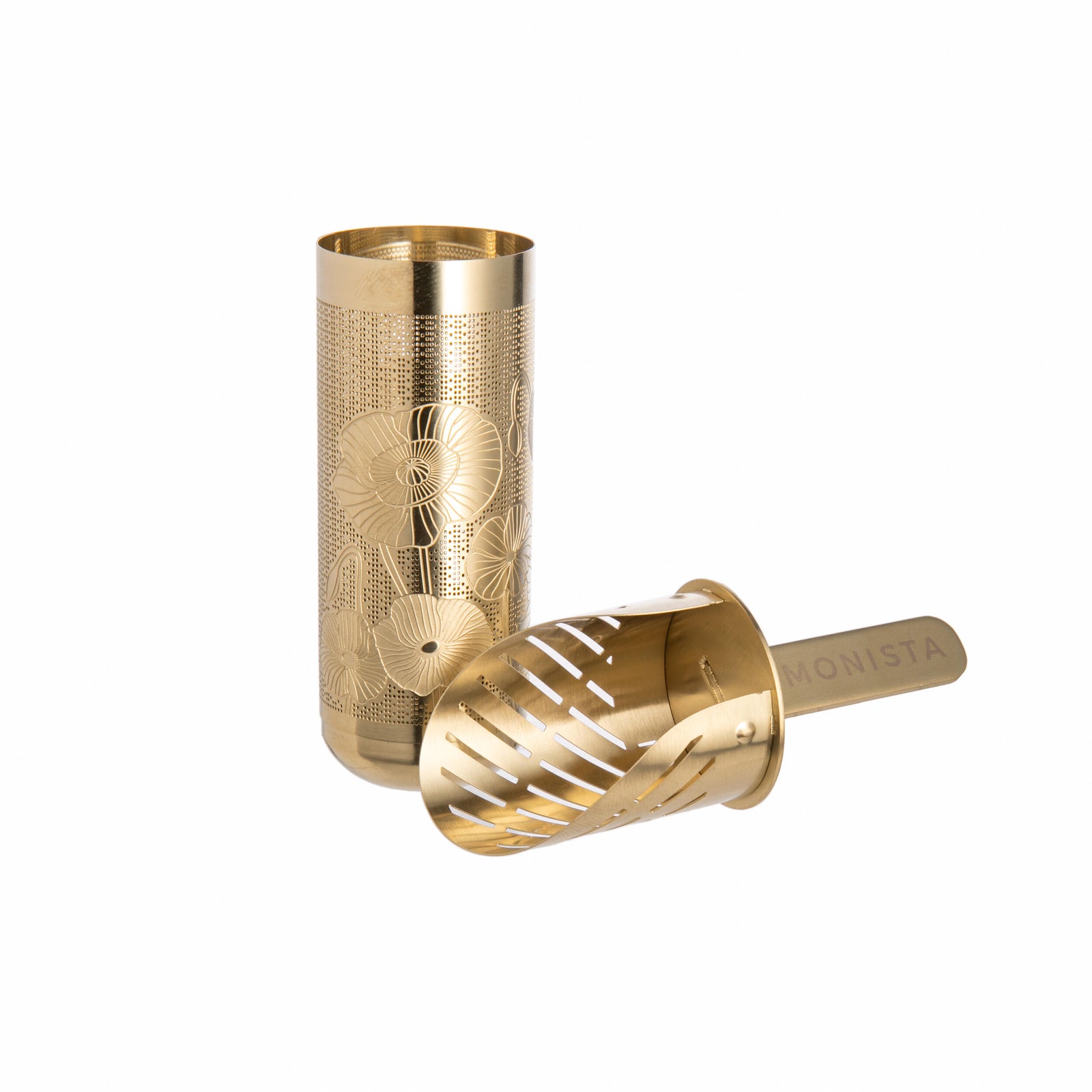 Gold tea infuser with floral packaging labeled 'MONISTA' on a white background