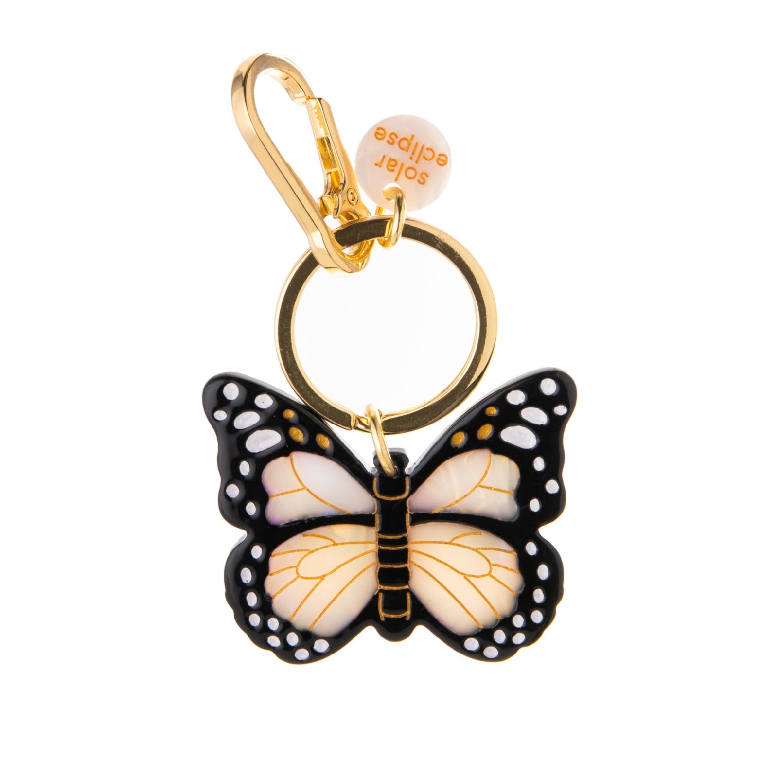 Butterfly-shaped keychain with gold accents on a white background