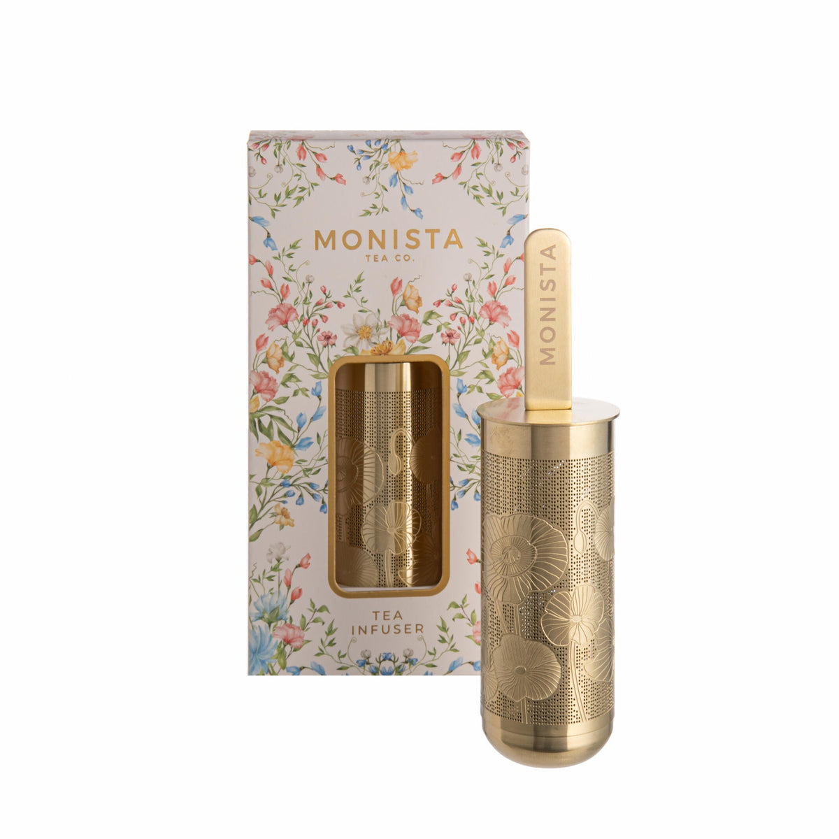 Gold tea infuser with floral packaging labeled &#39;MONISTA&#39; on a white background