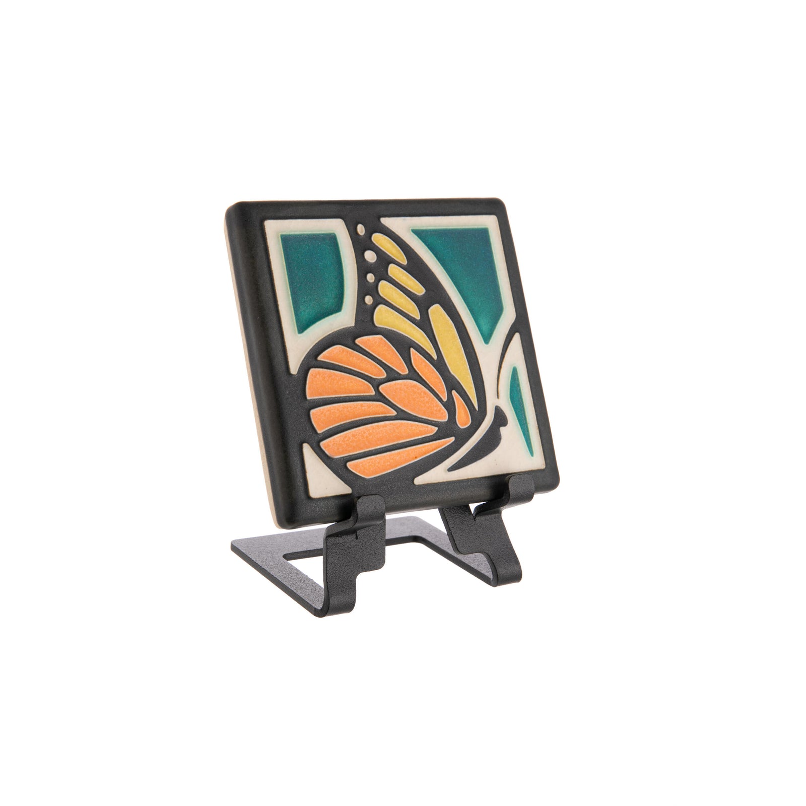 This delightful Motawi Tileworks tile depicts an elegant monarch butterfly with a deep turquoise background, rendered in a classic Arts & Crafts style.