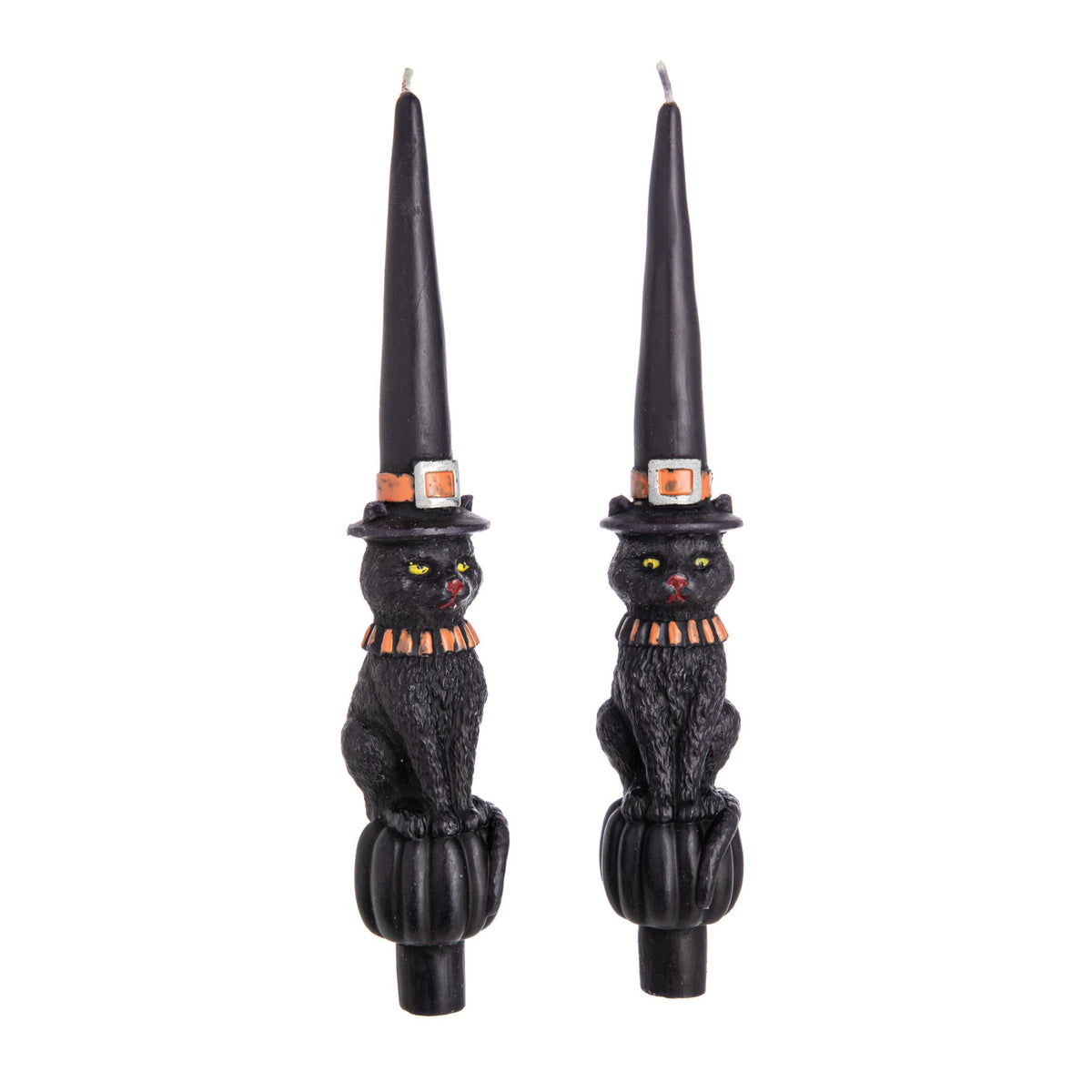 Black cat-shaped taper candles with witch hats on a white background
