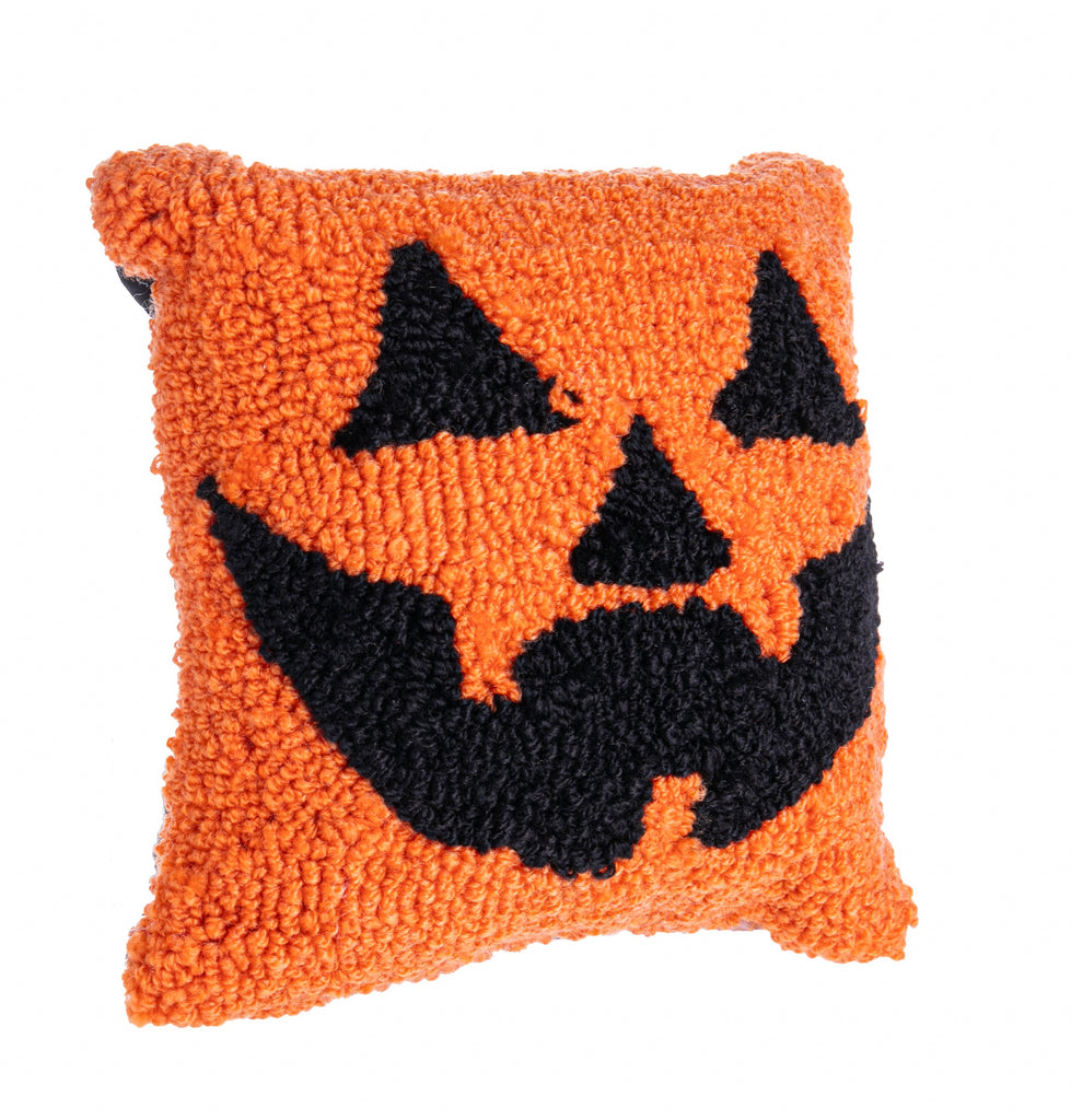 Add a fiendishly fun pop to your Halloween decor with this creepily cute Jack O' Lantern mini hooked pillow. The front is made from hardwearing hooked acrylic wool which creates a wonderfully three-dimensional effect. The reverse is a soft black cotton canvas. Cover not removeable. Dimensions: 8"x 8".