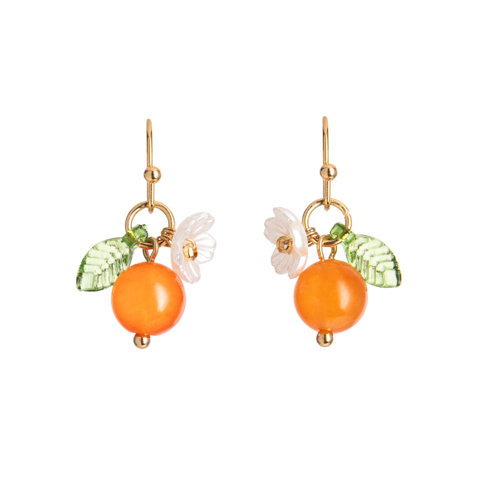 Pair of earrings with orange beads and floral elements on a white background