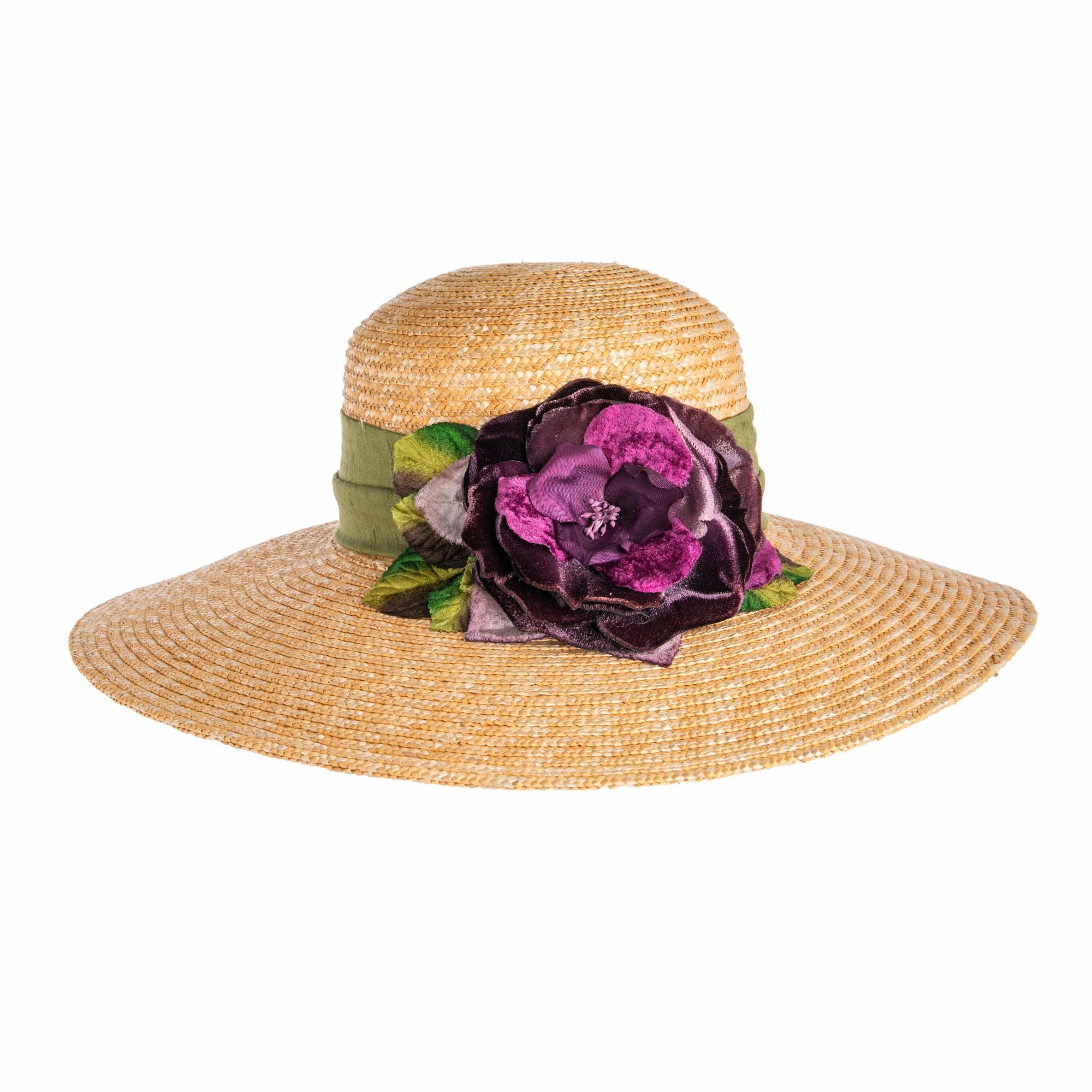 Keep the sun’s rays at bay elegantly with this super chic wide-brim straw hat. It is lightweight and comfortable enough to wear all day and is the perfect accessory for beach days, garden parties, and picnics. The woven natural straw is accented with an olive silk shantung hat band, trimmed with a velvet rose in deep aubergine and plum tones. One size fits most.