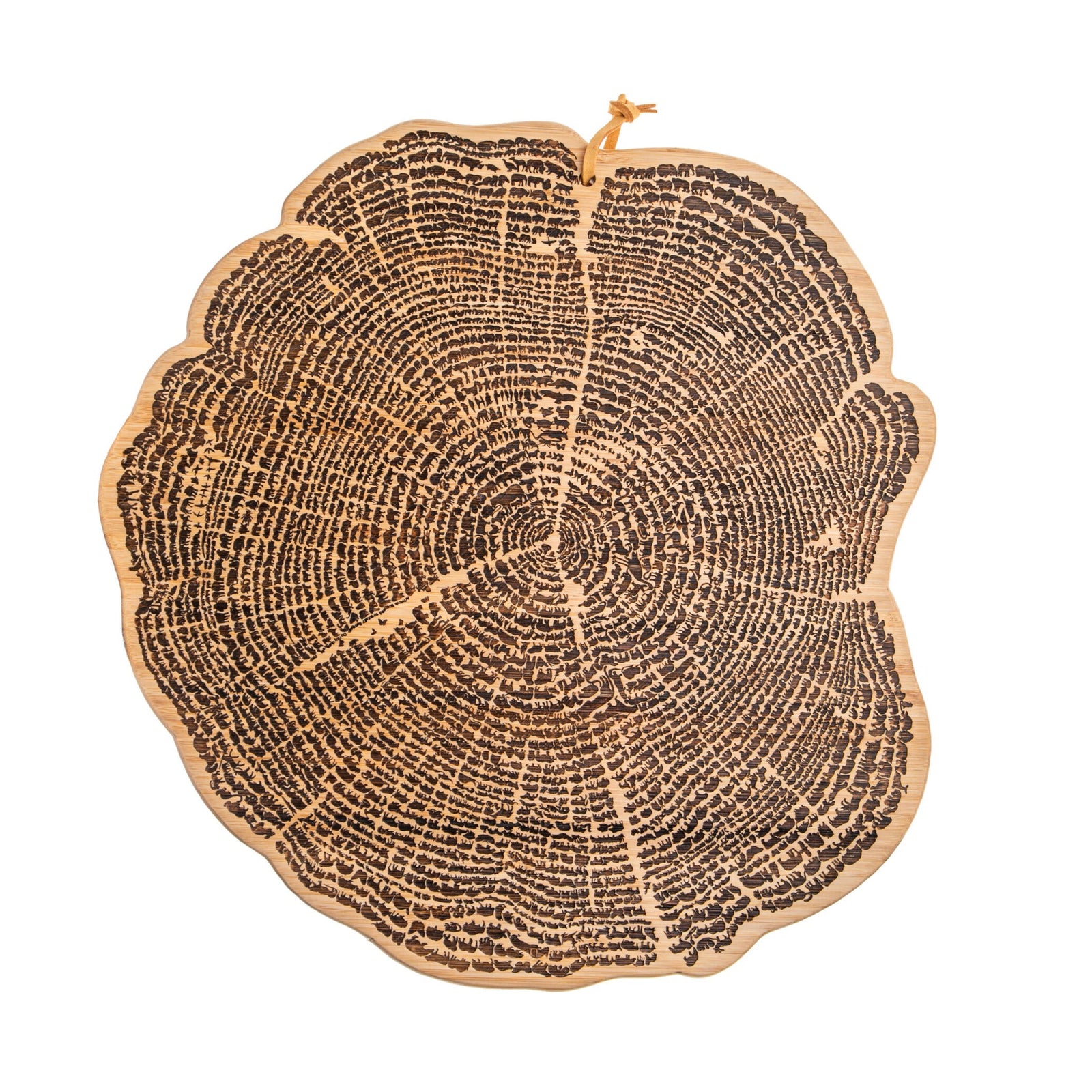A cutting board shaped like a cross-section of a tree trunk showing annual rings on a white background
